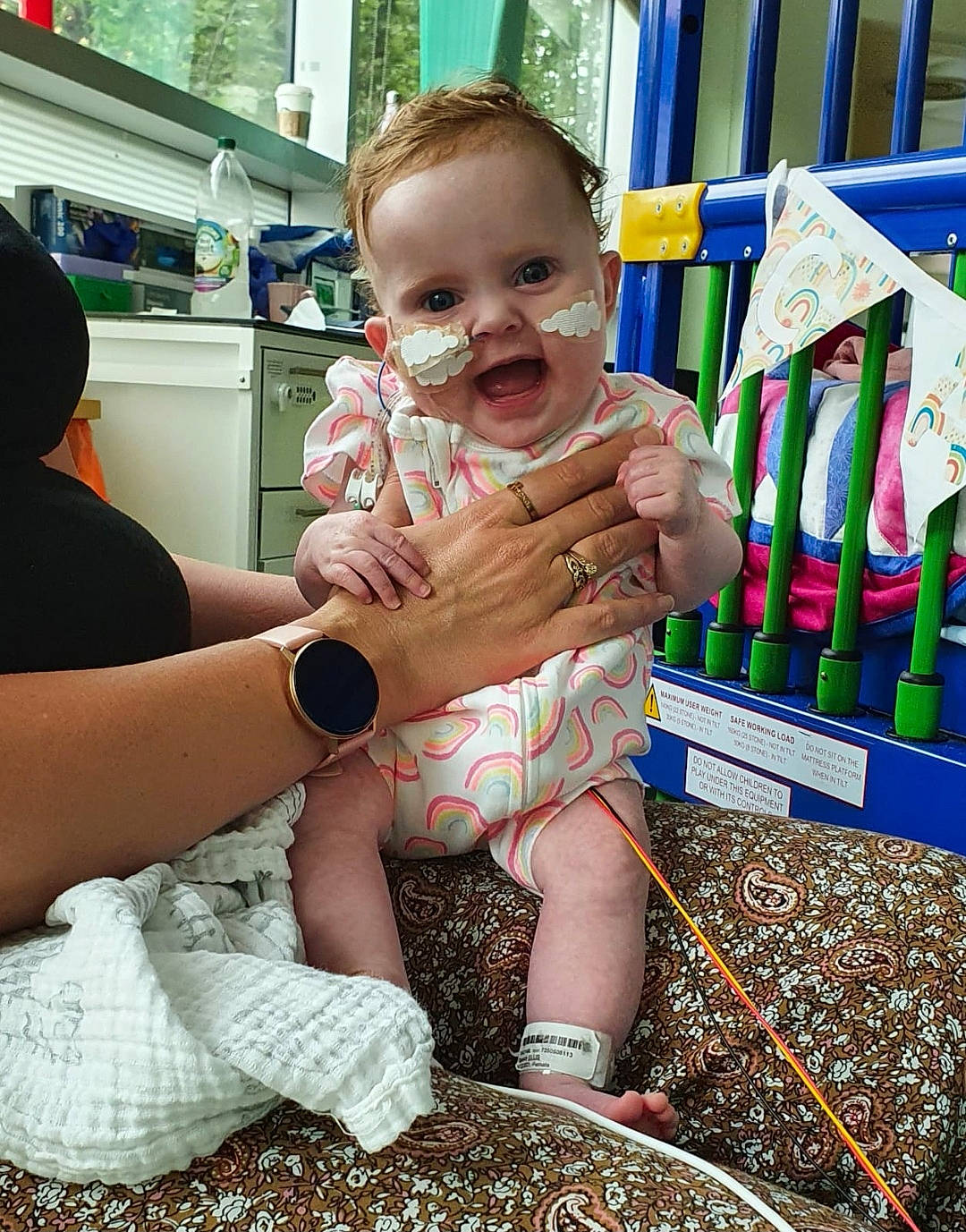 Cassidy is registered to the contest to win money with this photo: adaptation, baby, baby_toddler_clothing, child, event, finger, flag, foot, fun, grass, happy, human_leg, leisure, nail, person, shorts, sitting, thigh, thumb, toddler