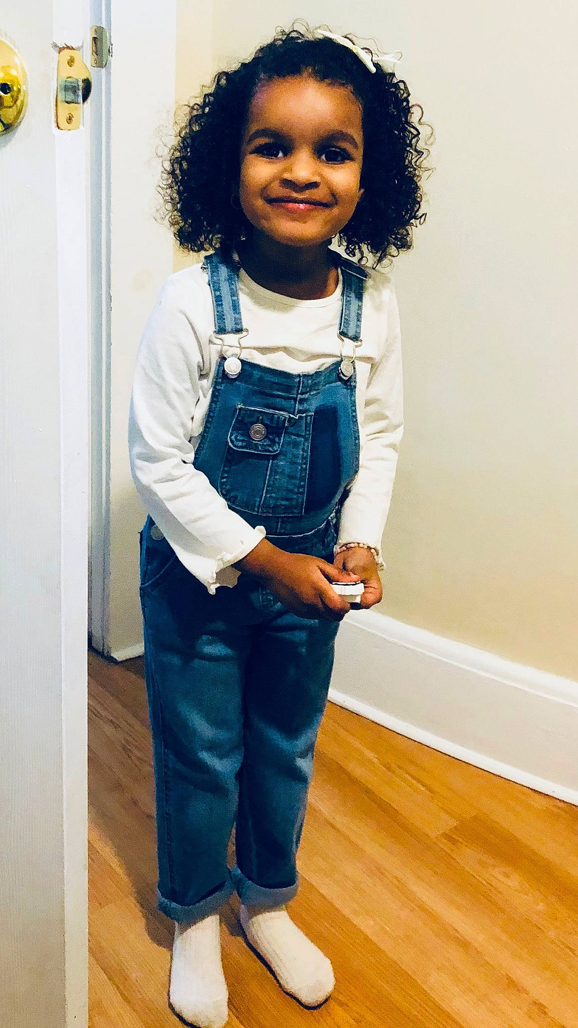 Cyara is registered to the contest to win money with this photo: baby_toddler_clothing, button, child, denim, electric_blue, fashion_design, flooring, formal_wear, gesture, happy, jeans, joy, person, sleeve, smile, t_shirt, toddler, uniform, waist, wood
