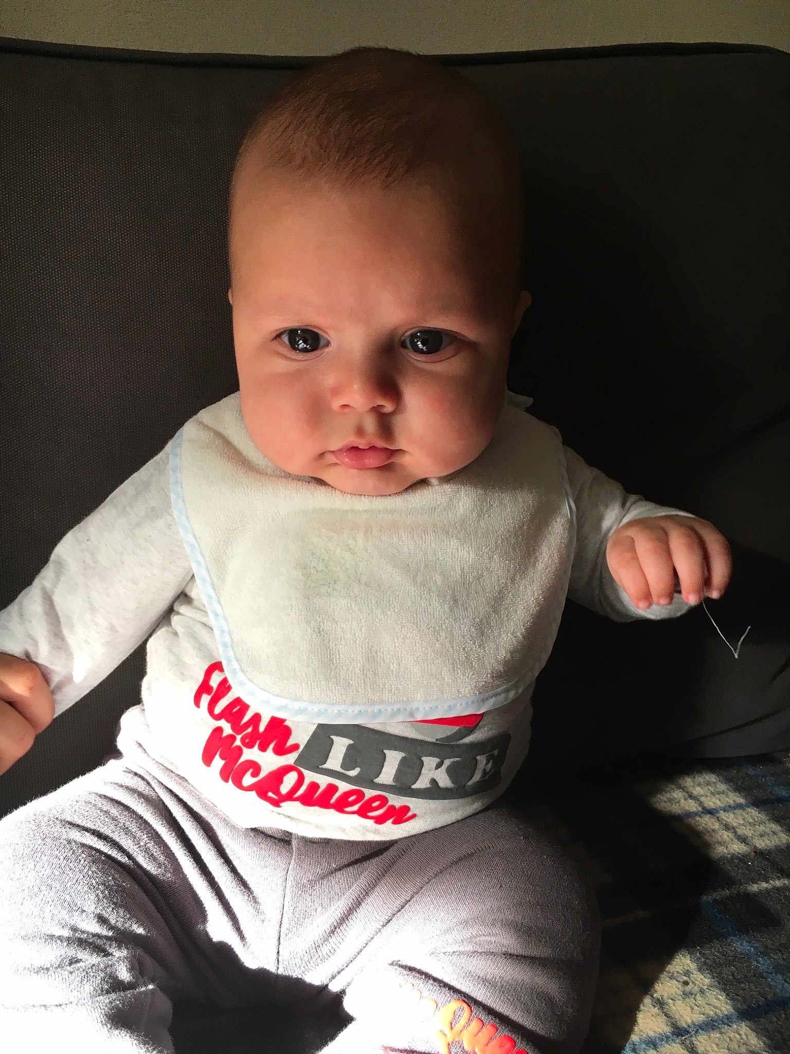 Massil participe au concours pour gagner de l'argent avec cette photo : arm, baby, baby_toddler_clothing, cheek, child, chin, cool, eye, face, head, lip, mouth, person, sitting, skin, sleeve, smile, t_shirt, toddler