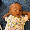baby, sleeping, infant, child, floral_clothing, blue_carpet, relaxed, closeup, indoors, peaceful, cute, portrait, toddler, skin, head, mouth_open, arms_up, young_child, resting, cozy