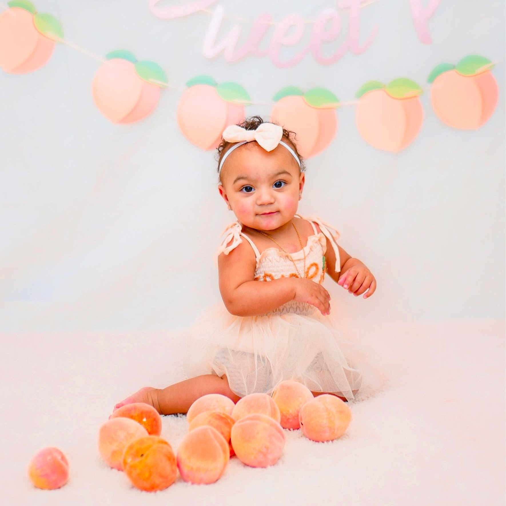 Aryah joined the competition — help win amazing prizes! accessories, baby, balloon, clothing, dress, face, flower, food, fruit, hat, head, newborn, peach, people, person, photography, plant, portrait, produce, sitting