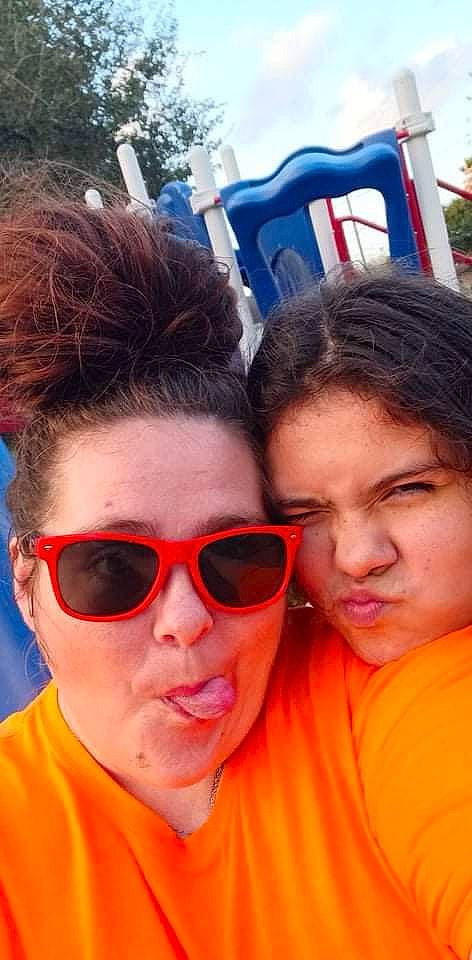 Maria Zamora is registered to the contest to win money with this photo: chin, cool, eye_glass_accessory, eyebrow, eyewear, forehead, fun, goggles, hairstyle, happy, leisure, lip, mouth, nose, orange, person, red, sunglasses, t_shirt, vision_care