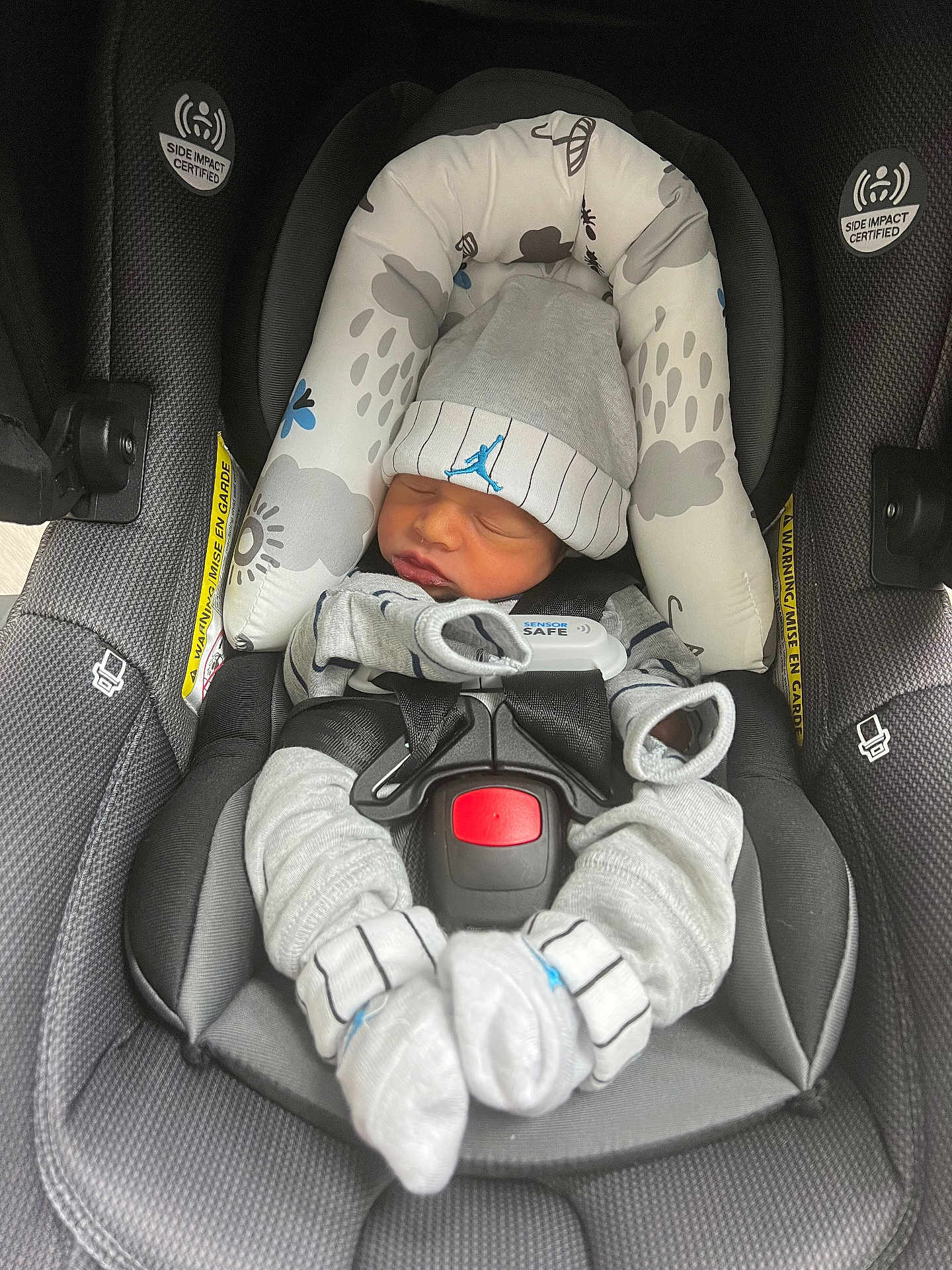 Ashton joined the competition — help win amazing prizes! newborn, baby, car_seat, hat, clothing, sleeping, infant, seat_belt, safety, fabric, cushion, pattern, grey, small_hands, cute, resting, indoors, comfort, child, bundle