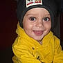 toddler, child, smiling, beanie, hat, yellow_hoodie, happy, indoor, cute, face, portrait, baby, clothing, person, headwear, warm_clothes, joyful, closeup, expression, casual
