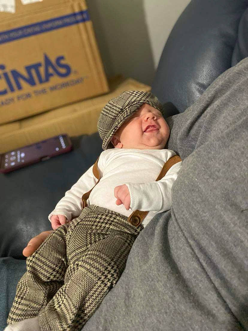 Jesse Ray joined the competition — help win amazing prizes! baby, baby_toddler_clothing, car_seat, child, comfort, couch, flooring, foot, headwear, human_leg, knee, lap, linens, nap, person, room, sitting, sock, thigh, toddler