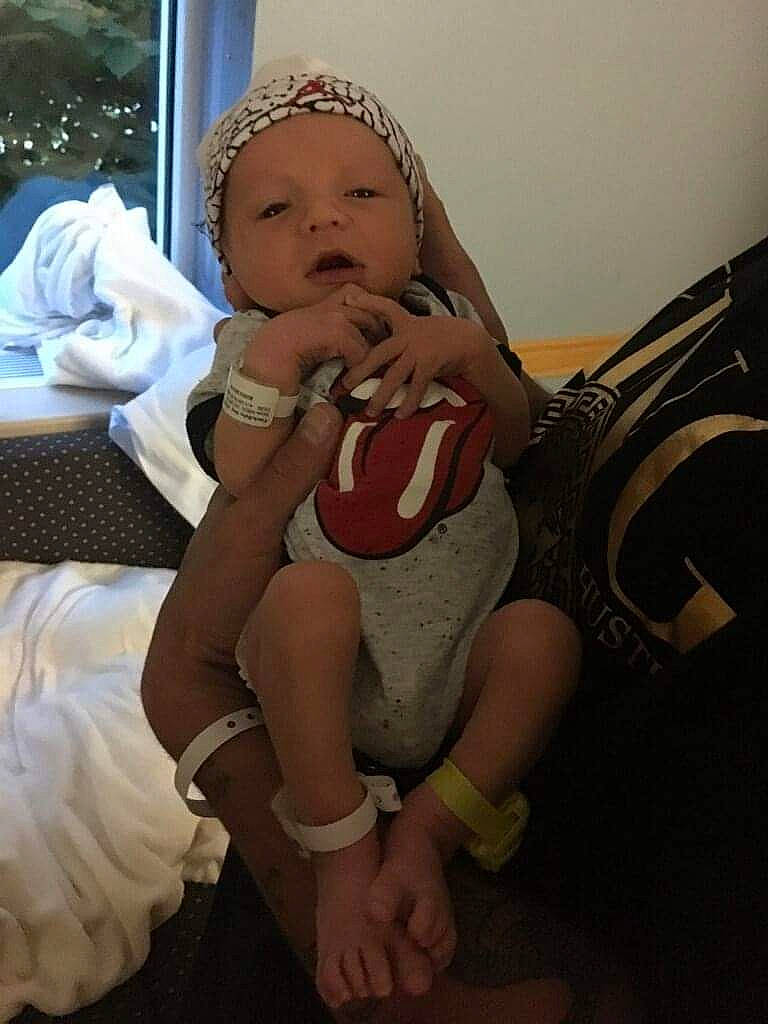 Julien Anthony is registered to the contest to win money with this photo: arm, baby, birth, cheek, child, finger, fun, leg, mouth, person, sitting, skin, smile, toddler, vacation