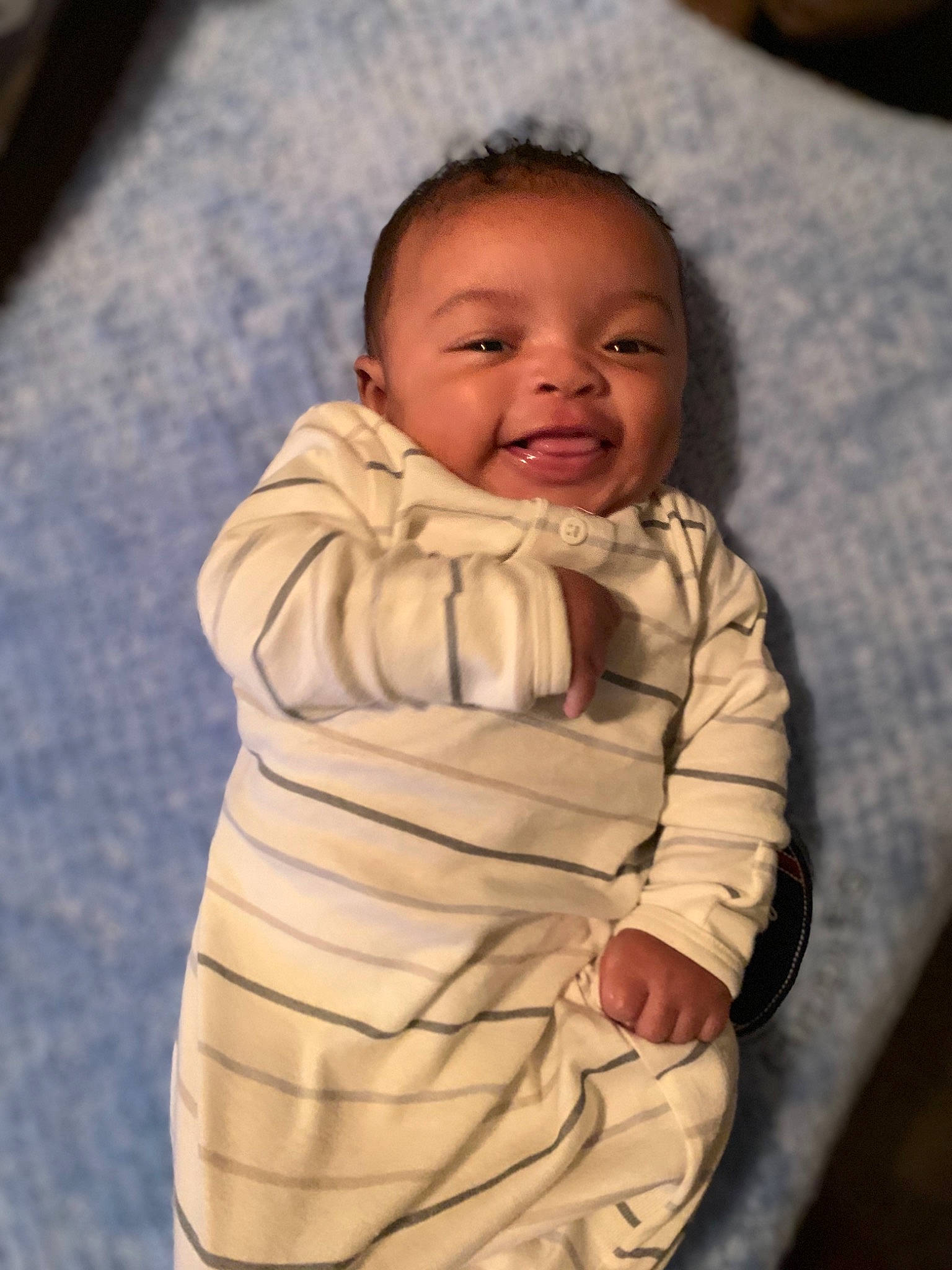 Kyaire is registered to the contest to win money with this photo: baby, baby_toddler_clothing, cheek, chin, comfort, eye, eyebrow, face, facial_expression, happy, head, iris, lip, mammal, mouth, nose, person, skin, sleeve, smile