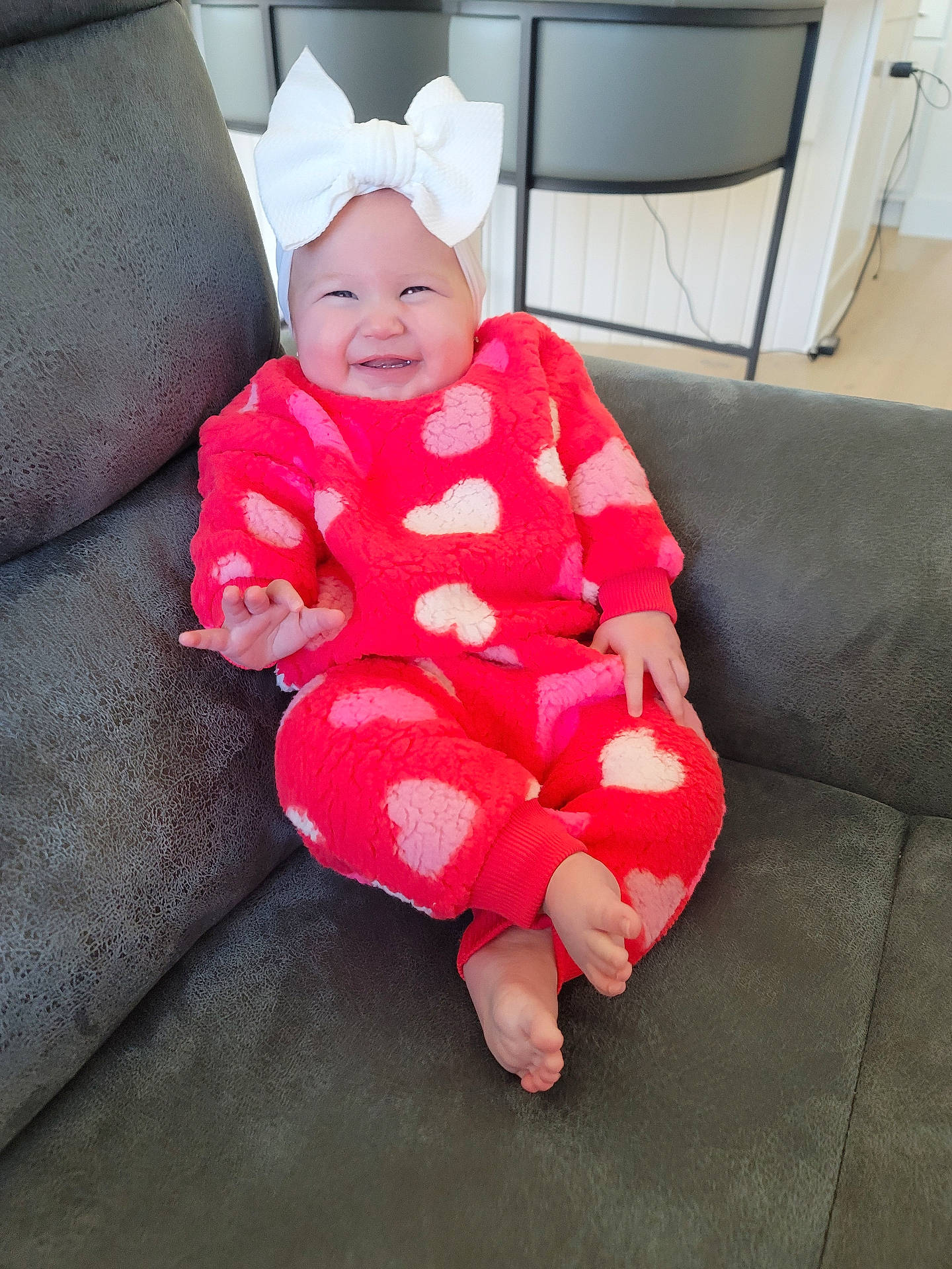 Adrianna joined the competition — help win amazing prizes! architecture, baby, bonnet, building, cap, clothing, couch, cushion, dress, face, furniture, hat, head, homedecor, indoors, livingroom, person, photography, portrait, room