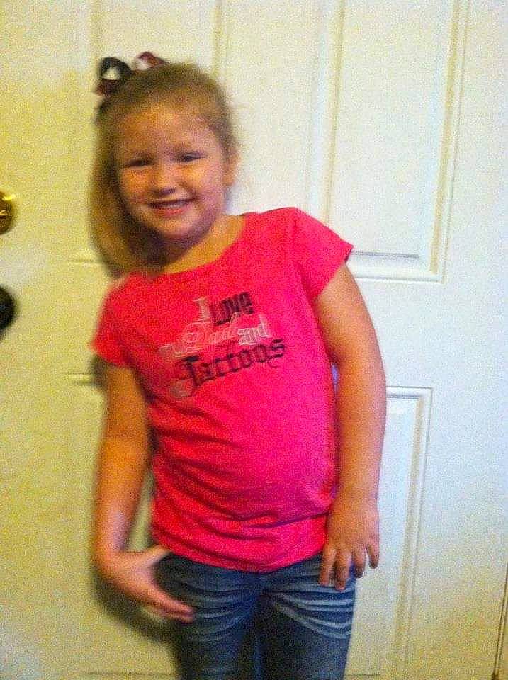 Alyssa is registered to the contest to win money with this photo: abdomen, arm, child, fun, hair, hairstyle, joint, joy, long_hair, magenta, mouth, neck, person, pink, shoulder, smile, standing, t_shirt, top