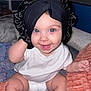 Mila Grace is registered to the contest to win money with this photo: baby, child, smiling, face, headwear, bonnet, diaper, white_shirt, blue_eyes, bed, blanket, pillow, indoor, happy, cute, infant, skin, person, playful, seated