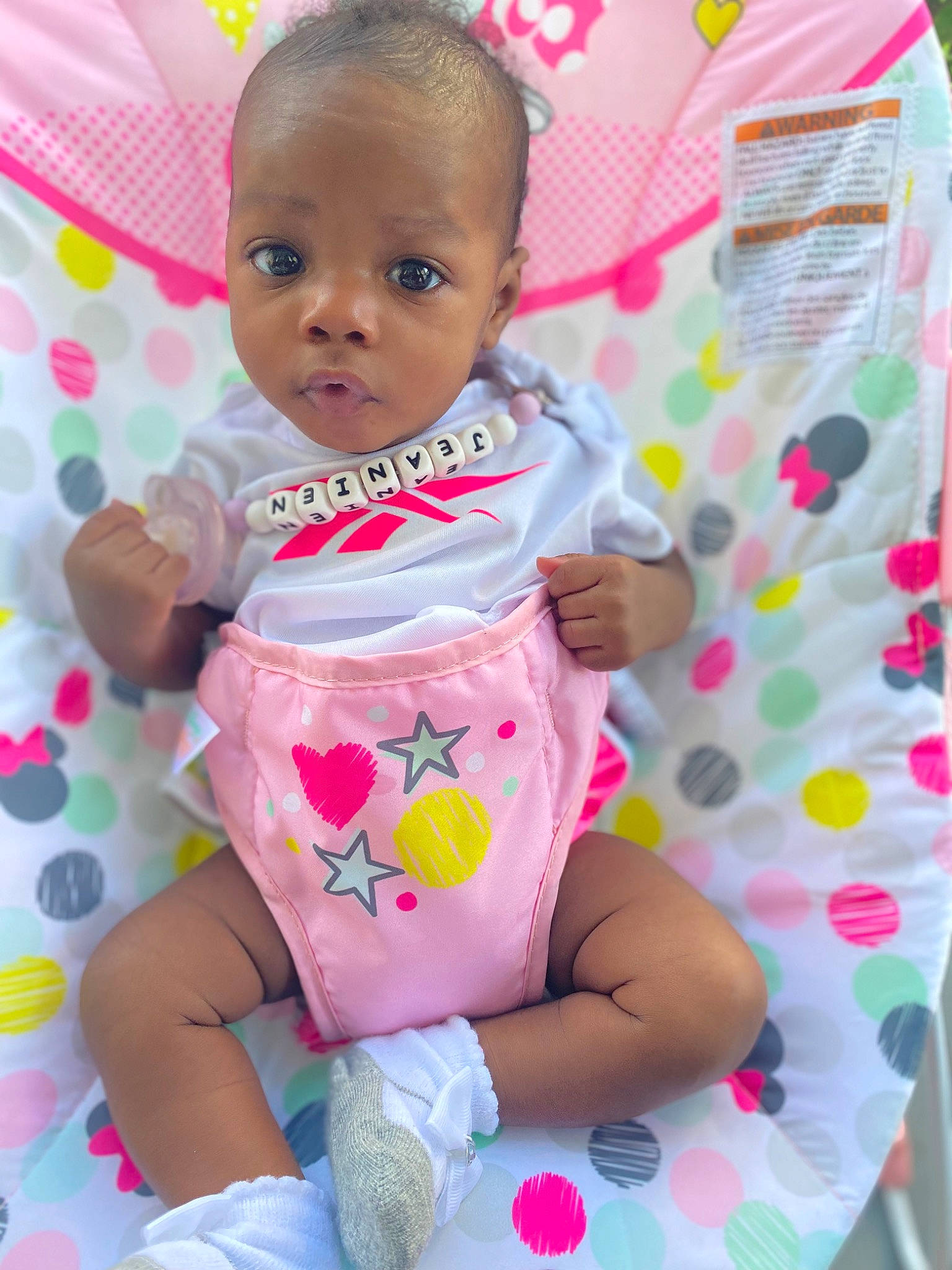 Hajirah joined the competition — help win amazing prizes! baby, baby_products, baby_toddler_clothing, cheek, child, face, fun, happy, head, linens, magenta, pattern, person, pink, sitting, skin, sleeve, sock, thigh, toddler