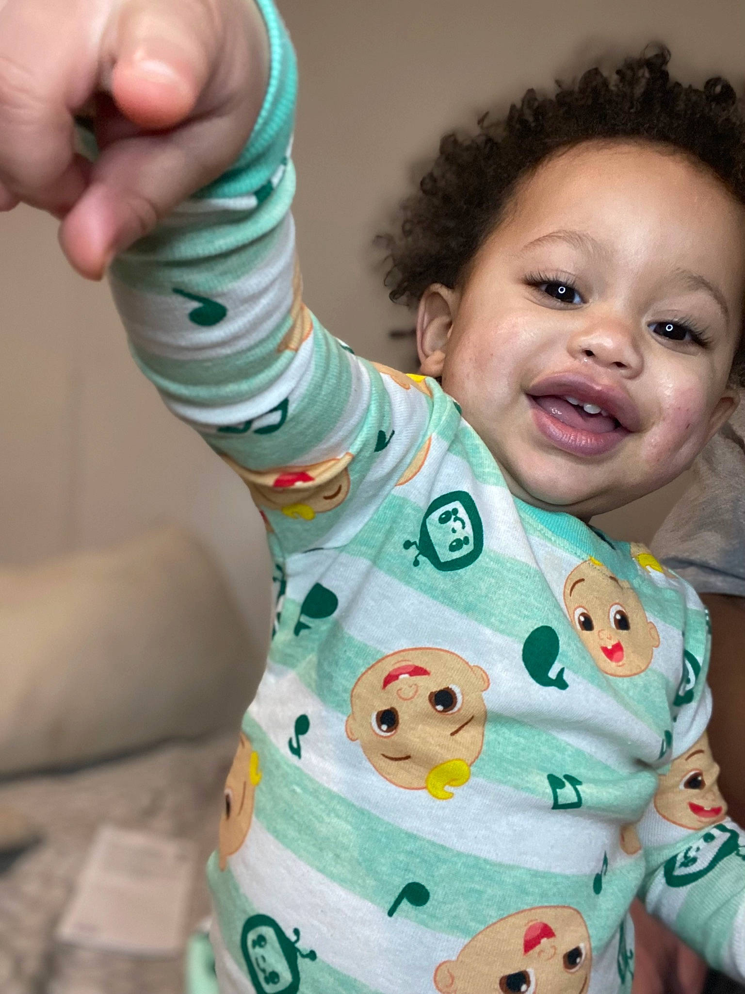 Josiah is registered to the contest to win money with this photo: arm, baby, baby_toddler_clothing, cheek, drinkware, face, facial_expression, finger, gesture, hand, happy, joint, neck, nose, person, product, skin, sleeve, smile, thumb