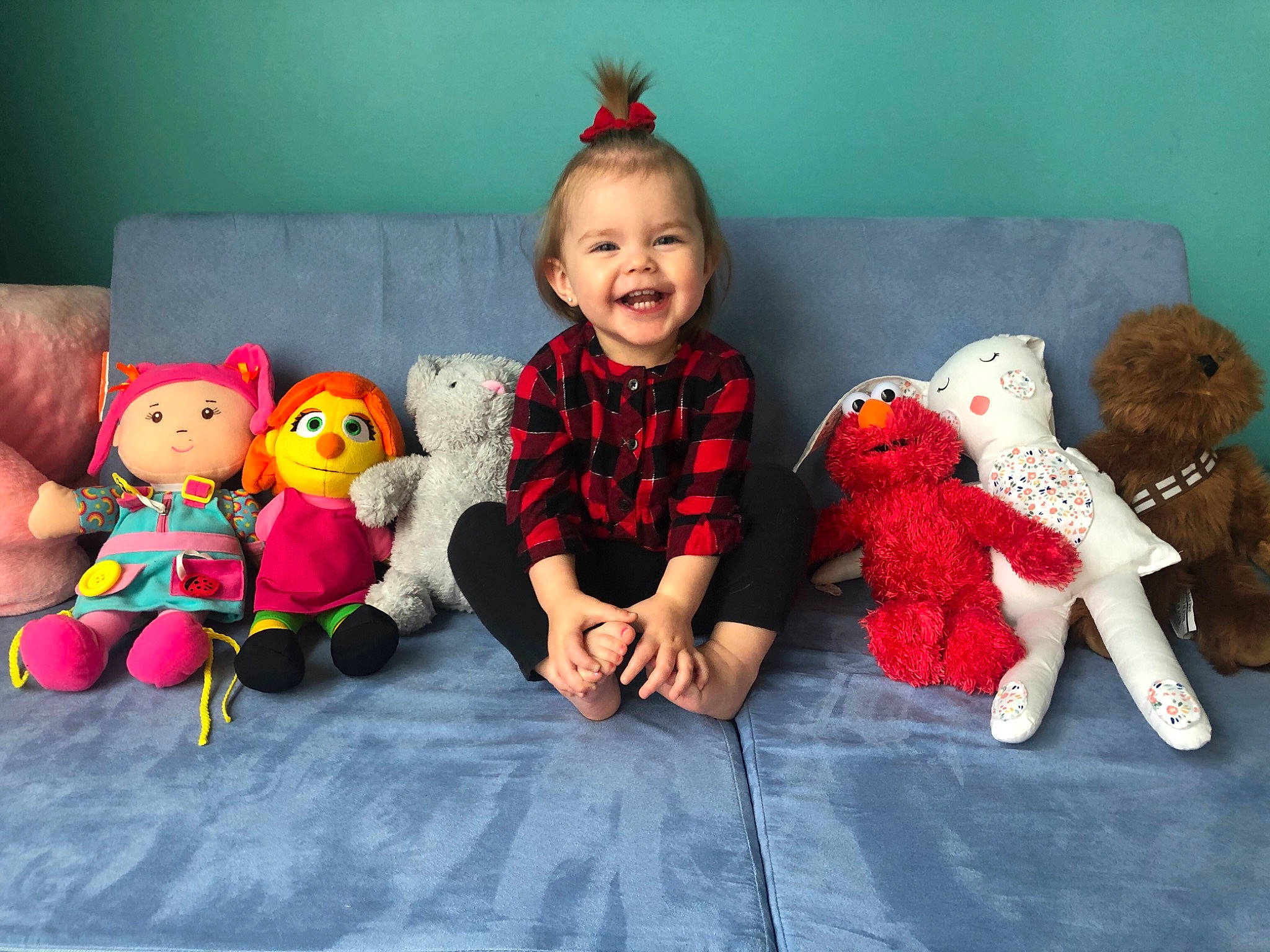 Maggie is registered to the contest to win money with this photo: baby, baby_products, baby_toddler_clothing, baby_toys, couch, craft, doll, hair_accessory, joy, person, plush, primate, stuffed_toy, teddy_bear, textile, toy, vertebrate