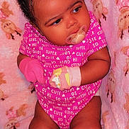 Kira joined the competition — help win amazing prizes! baby, infant, pacifier, pink_onesie, mittens, curly_hair, blanket, cartoon_sheep, soft_texture, cute, chubby_cheeks, sitting, indoors, child, young_baby, comfortable, cozy, portrait, closeup, adorable