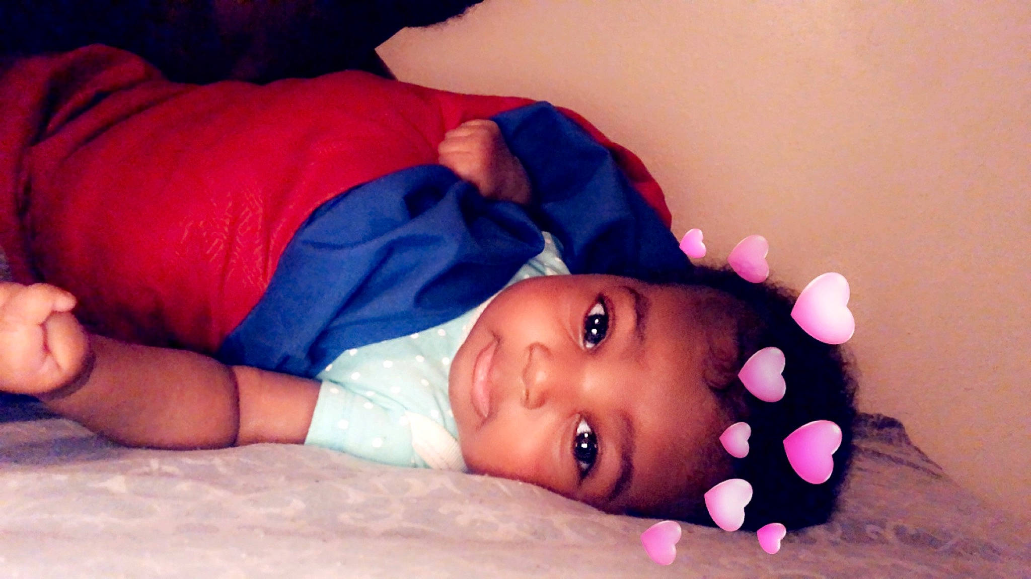 Naomi is registered to the contest to win money with this photo: baby, beauty, bedtime, cheek, child, close_up, eye, face, finger, fun, hand, head, lip, mouth, neck, nose, person, photography, pink, skin