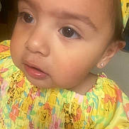 Oakley joined the competition — help win amazing prizes! toddler, child, close_up, face, yellow_dress, headband, earring, curious_eyes, portrait, baby, colorful, floral_pattern, cute, skin, indoor, person, expression, young_child, fashion, smile