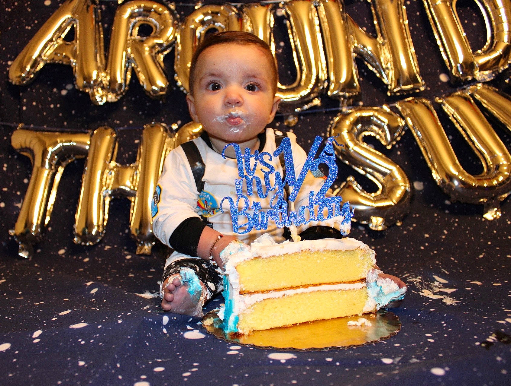 Nori joined the competition — help win amazing prizes! baby, birthday_cake, chair, child, dessert, electric_blue, event, flash_photography, food, fun, happy, icing, jewellery, leisure, metal, person, sitting, snapshot, sugar_cake, toddler