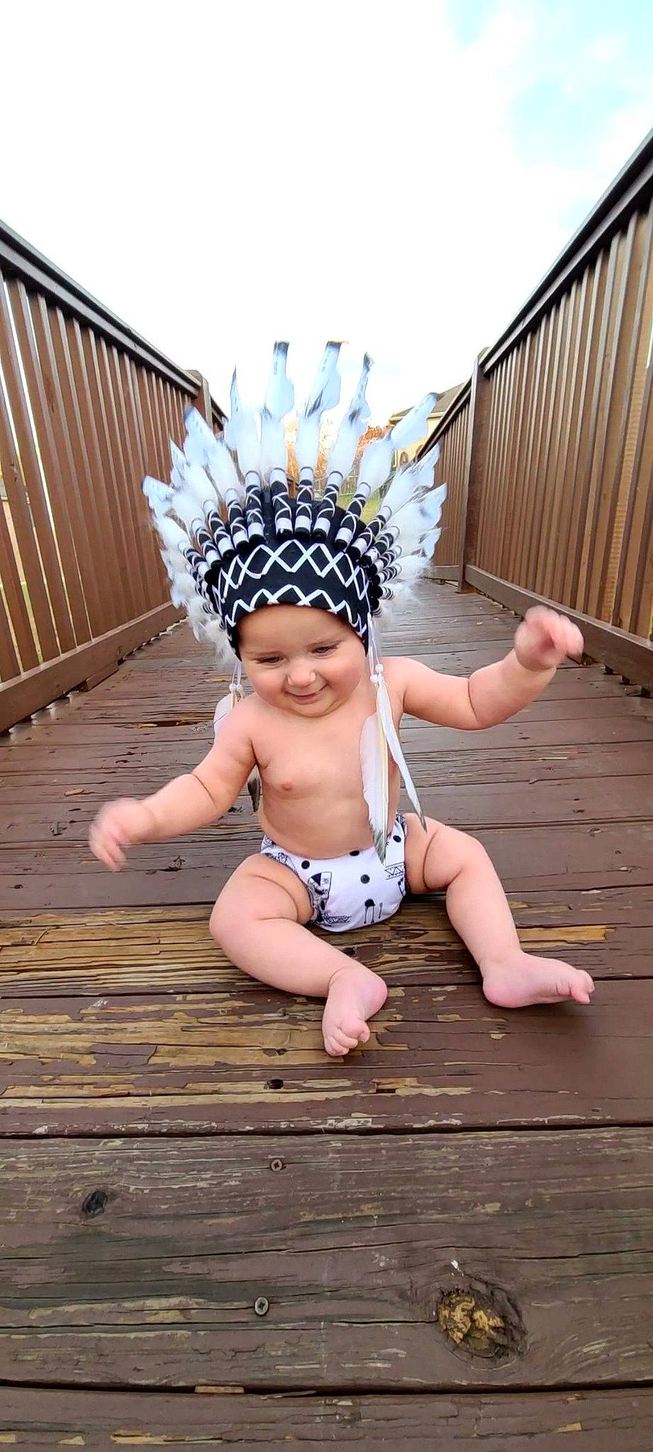 Ezekiel is registered to the contest to win money with this photo: baby, baby_toddler_clothing, child, clothing, costume, face, fashion_accessory, flash_photography, grass, happy, hardwood, headband, headgear, headpiece, headwear, human_body, human_leg, jewellery, joy, person
