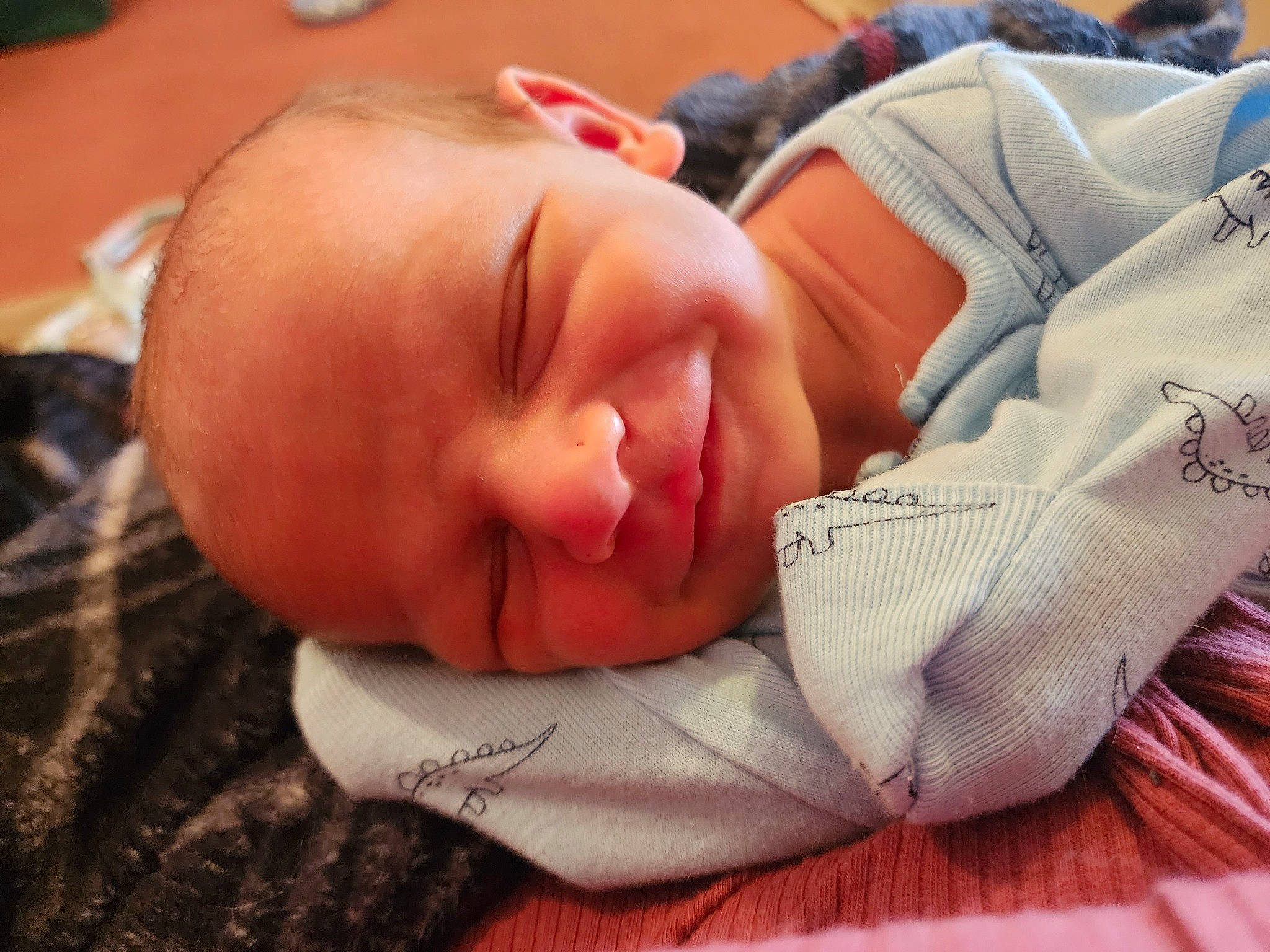 Jensen is registered to the contest to win money with this photo: baby, baby_products, baby_toddler_clothing, bedtime, carmine, cheek, child, clock, comfort, ear, flesh, joy, linens, mouth, nap, nose, person, skin, sleep, smile