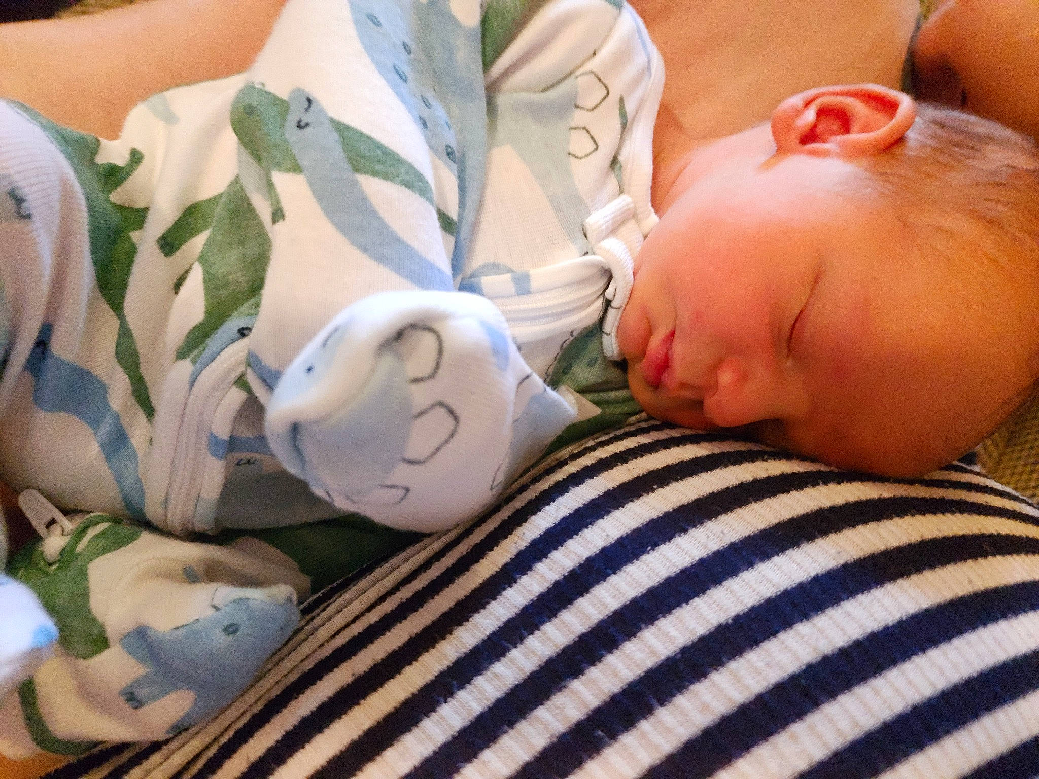 Jensen is registered to the contest to win money with this photo: abdomen, baby, baby_sleeping, bed_sheet, bedding, bedtime, child, comfort, grass, happy, linens, mammal, nap, person, reading, room, sitting, skin, sleep, textile