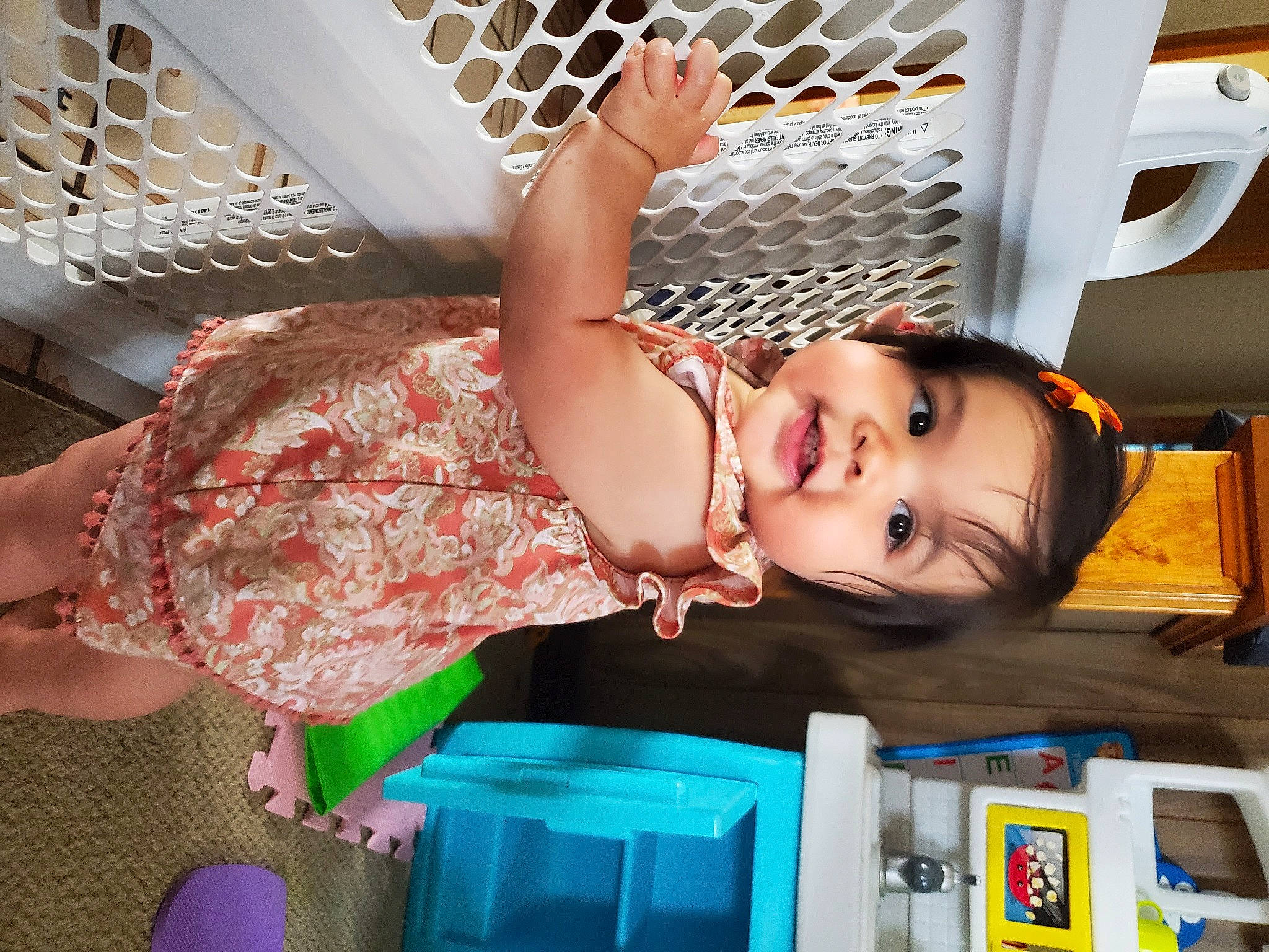 Ella is registered to the contest to win money with this photo: baby, baby_products, baby_toddler_clothing, child, electric_blue, facial_expression, flesh, fun, happy, human_leg, leisure, machine, mouth, organ, pattern, person, photography, room, smile, thigh