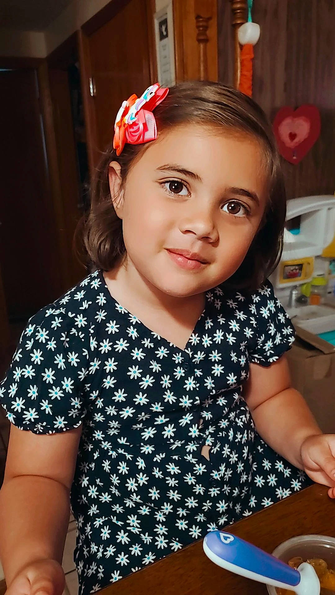 Kendall is registered to the contest to win money with this photo: baby_toddler_clothing, child, cooking, dishware, face, fashion_accessory, flash_photography, fun, hairstyle, happy, headband, headpiece, joy, pattern, person, plate, serveware, sleeve, smile, t_shirt