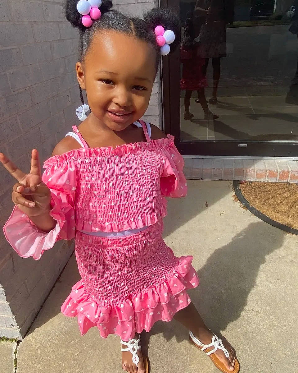 Kynlee is registered to the contest to win money with this photo: baby_toddler_clothing, beauty, child, costume, day_dress, embellishment, fashion_accessory, fun, hair_accessory, happy, headpiece, joy, magenta, pattern, person, pink, ruffle, sandal, sleeve, smile