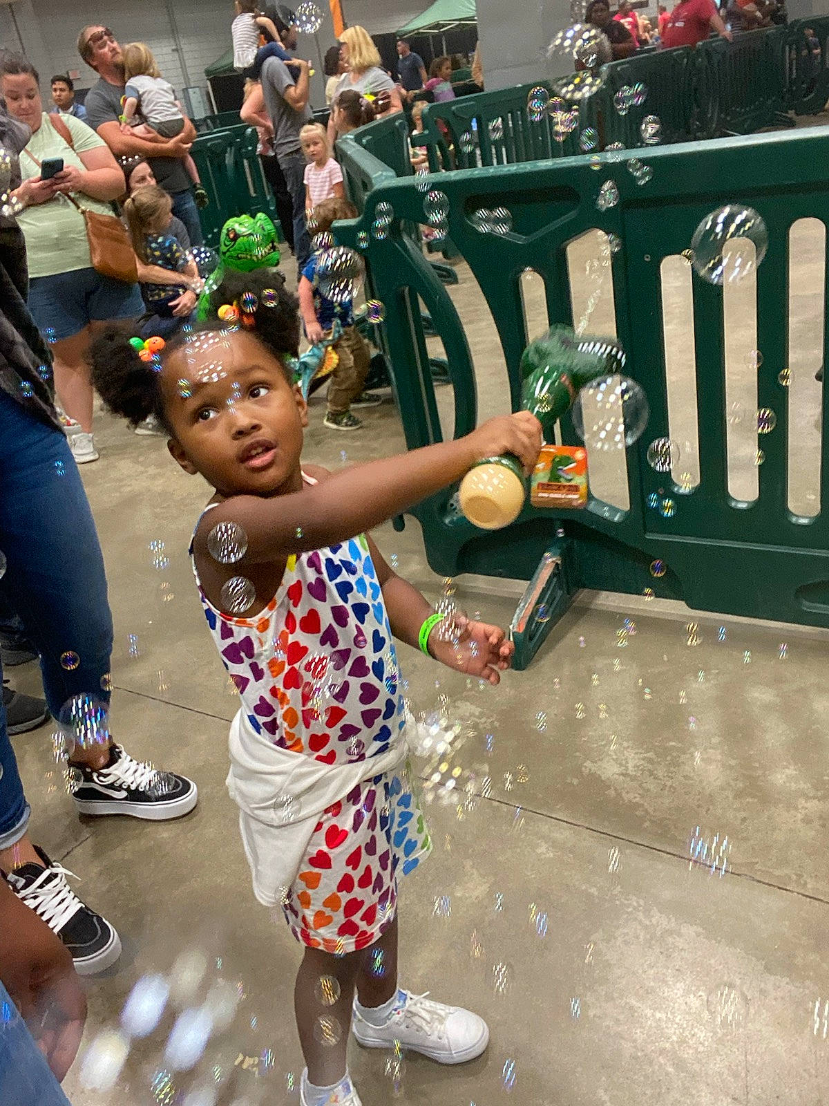 Kynlee joined the competition — help win amazing prizes! blurred, child, event, festival, fun, green, happy, hat, holiday, human, leisure, pedestrian, person, recreation, road, sandal, shoe, shorts, sneakers, street