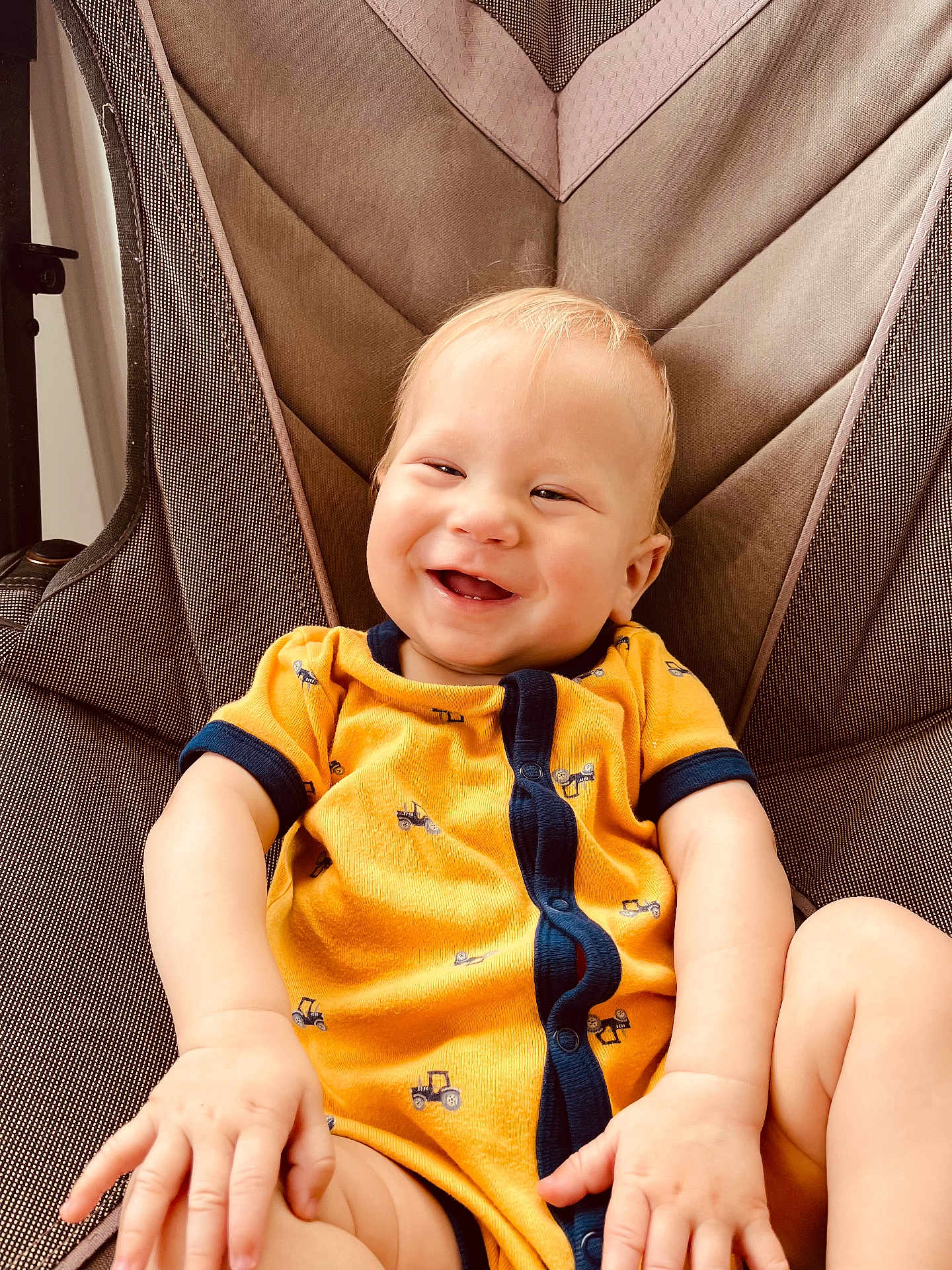 Huxlee joined the competition — help win amazing prizes! baby, babylaughing, bodypart, chair, clothing, cushion, face, finger, furniture, happy, head, homedecor, laughing, pants, person, photography, portrait, sitting, smile, t_shirt