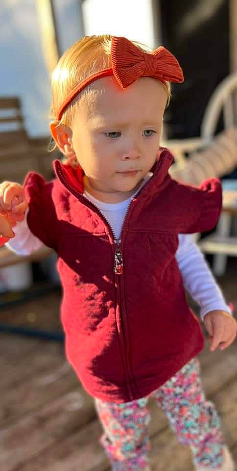 Everleigh is registered to the contest to win money with this photo: baby_toddler_clothing, beauty, cheek, child, cool, face, facial_expression, fun, grass, happy, headwear, iris, jacket, lip, person, pink, red, skin, sleeve, standing