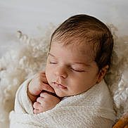 Louca participe au concours pour gagner de l'argent avec cette photo : baby, newborn, sleeping, wrapped, blanket, soft, cozy, infant, peaceful, hands, face, closeup, portrait, cute, basket, texture, warm, resting, indoors, skin