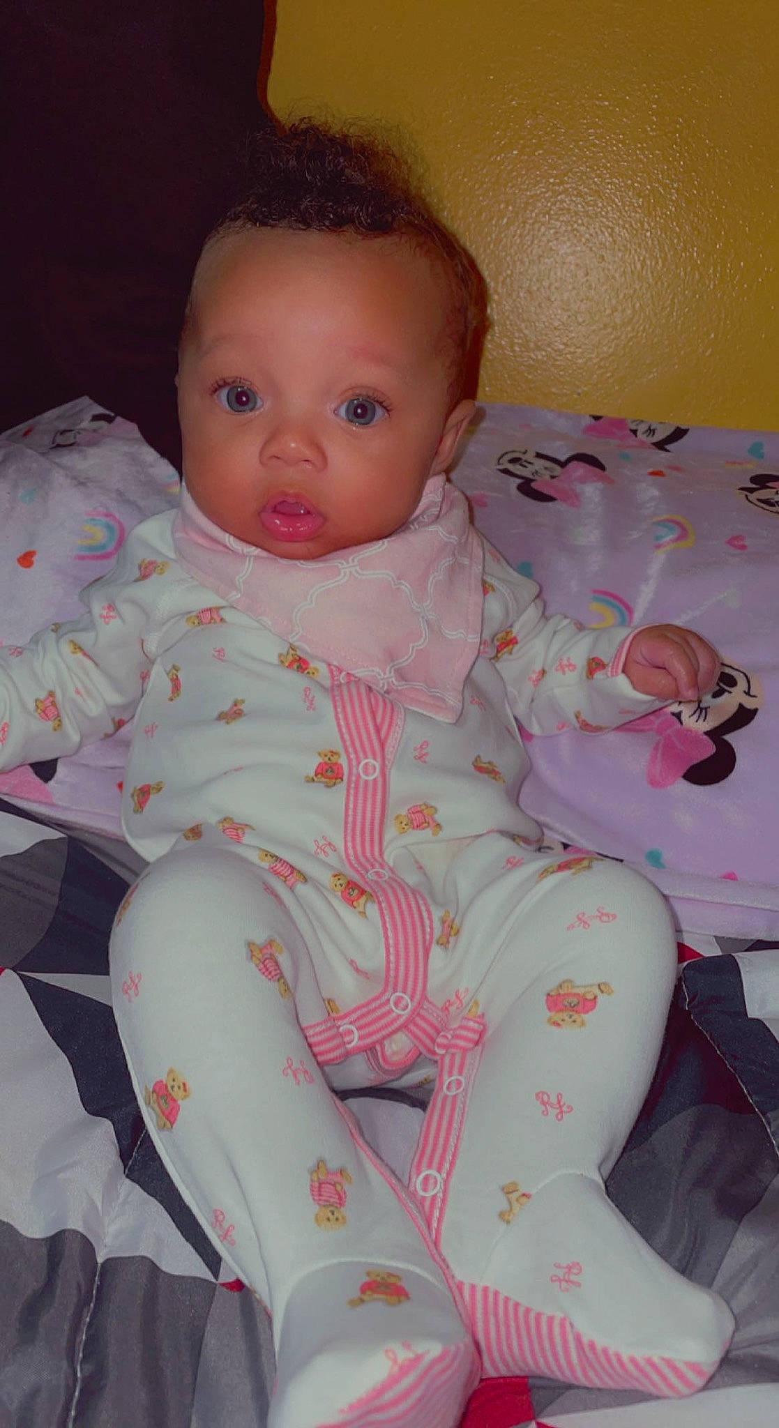 Aubrianna is registered to the contest to win money with this photo: baby, baby_products, baby_toddler_clothing, cheek, child, comfort, face, iris, linens, lip, neck, nose, pattern, person, pink, product, sitting, skin, sleeve, textile