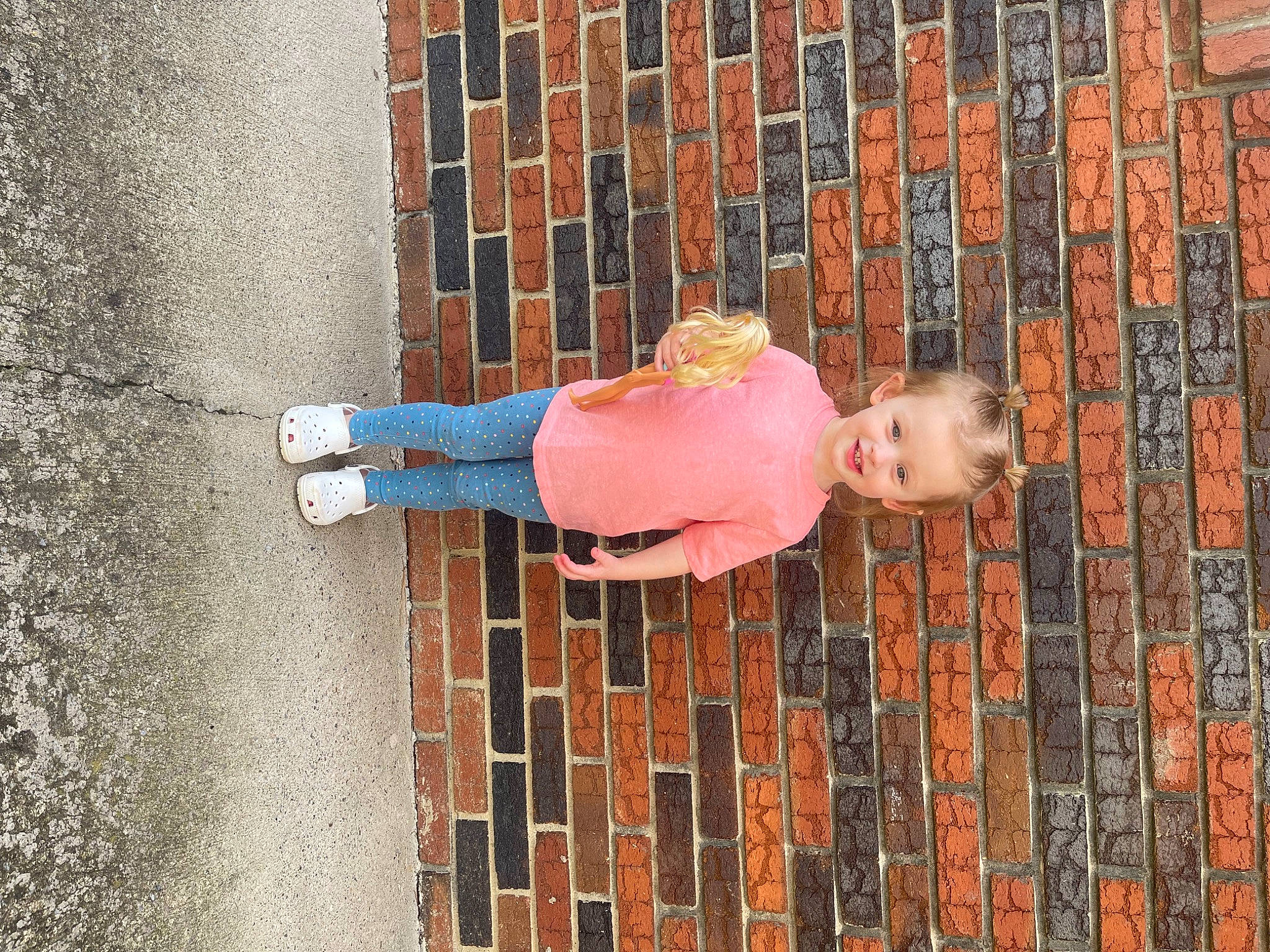 Hadlee joined the competition — help win amazing prizes! brick, brickwork, child, concrete, facade, flooring, fun, jeans, joy, magenta, pattern, person, plant, sitting, street, street_fashion, t_shirt, textile, toddler, visual_arts