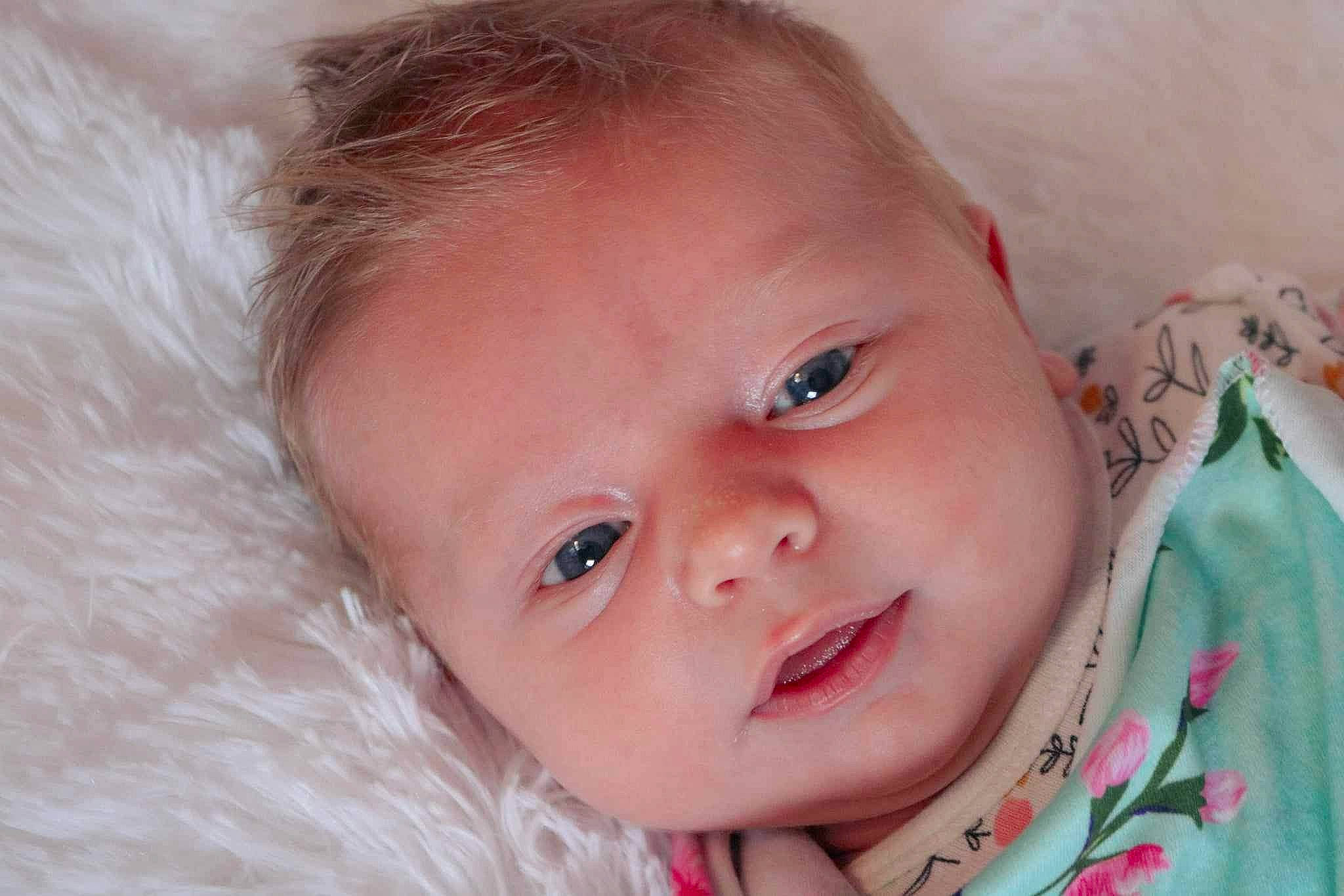 Sienna joined the competition — help win amazing prizes! baby, baby_toddler_clothing, cheek, child, close_up, comfort, ear, eyelash, hair, happy, head, iris, linens, lip, nose, person, pink, skin, smile, toddler