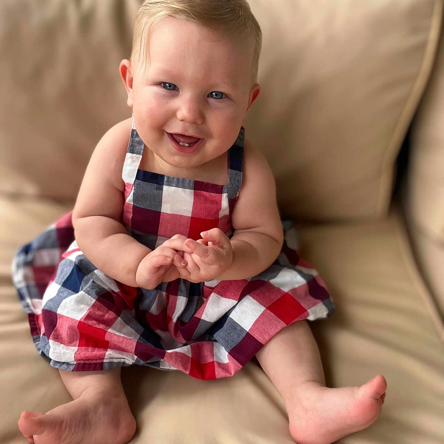 Sienna is registered to the contest to win money with this photo: baby, babylaughing, bodypart, clothing, couch, cushion, dress, face, finger, furniture, hand, happy, head, homedecor, pants, person, photography, portrait, sitting, smile