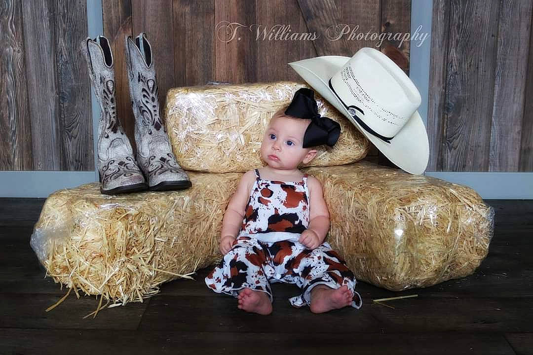 Ava joined the competition — help win amazing prizes! baby_toddler_clothing, child, comfort, costume_hat, cowboy_hat, fashion, fawn, fedora, fur, hat, mammal, person, room, shoe, sitting, stuffed_toy, sun_hat, teddy_bear, textile, toy