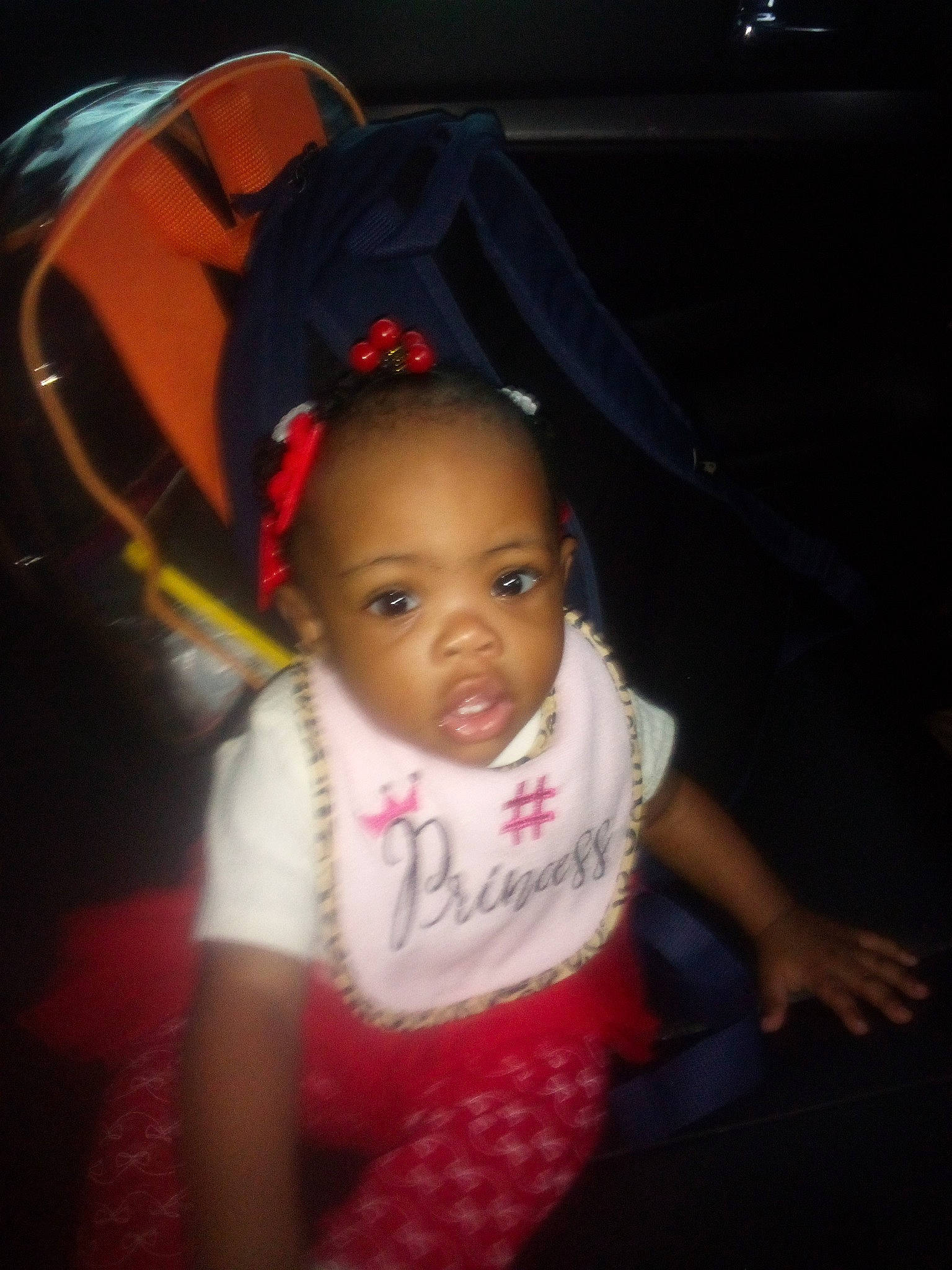 Amiyah is registered to the contest to win money with this photo: baby, baby_toddler_clothing, cap, cheek, child, darkness, eyelash, fashion_accessory, flash_photography, fun, happy, magenta, pattern, person, room, sitting, skin, sleeve, t_shirt, toddler