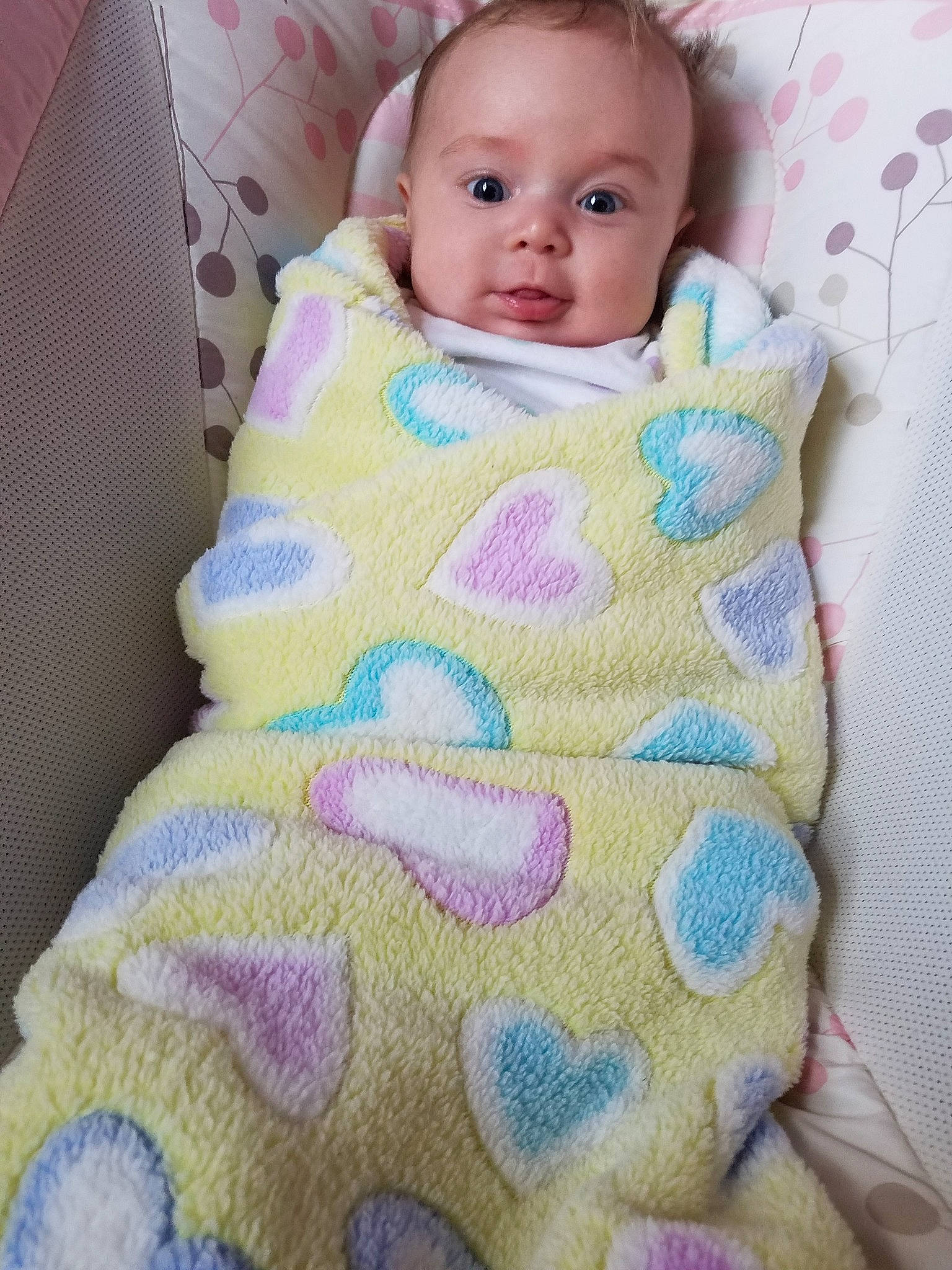 Hadley joined the competition — help win amazing prizes! baby, bedding, blanket, cheek, child, linens, nap_mat, pattern, person, pink, skin, smile, textile, toddler