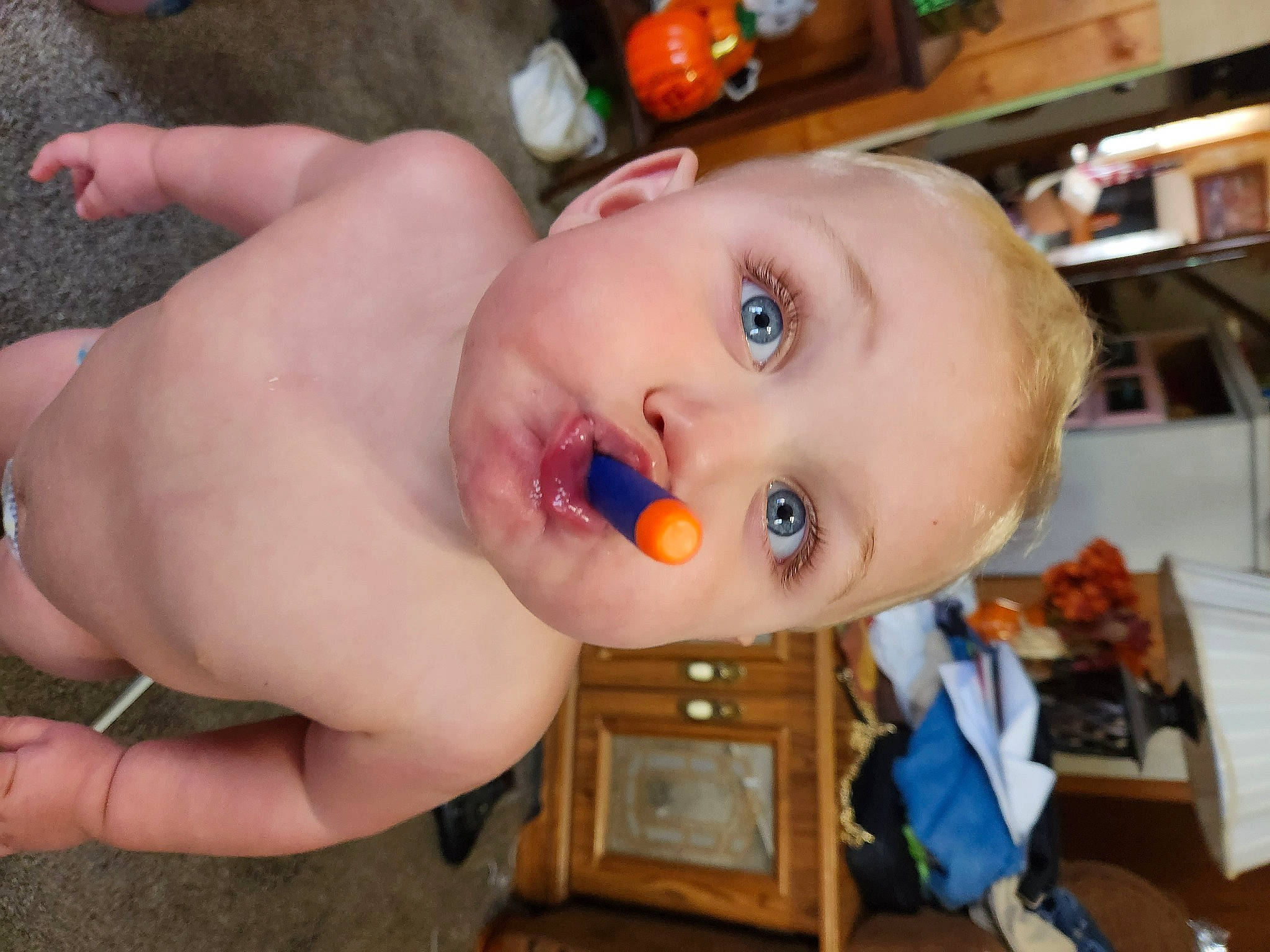 Gabriel is registered to the contest to win money with this photo: baby, baby_toys, bathing, cheek, chest, child, eye, eyebrow, eyelash, fun, happy, head, mouth, nose, person, plastic, shelf, shelving, toddler, toy