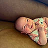 Maverick joined the competition — help win amazing prizes! baby, smiling, infant, couch, leather, happy, child, portrait, face, clothing, onesie, skin, head, baby_girl, baby_boy, young_child, indoor, relaxed, cute, lying_down