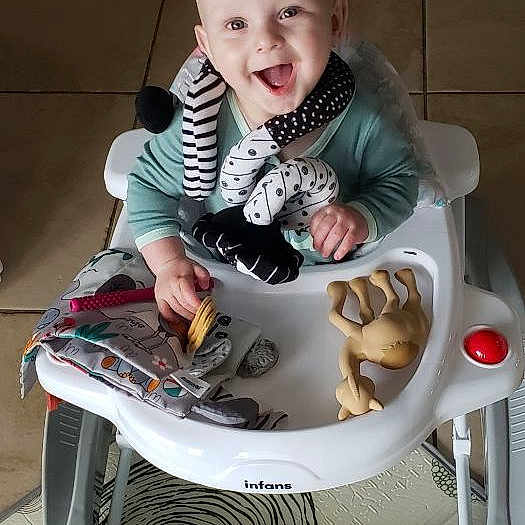 Christopher joined the competition — help win amazing prizes! baby, walker, toy, smiling, indoor, floor, tile, child, happy, infant, person, play, seat, cute, small, fun, childhood, joy, young, home