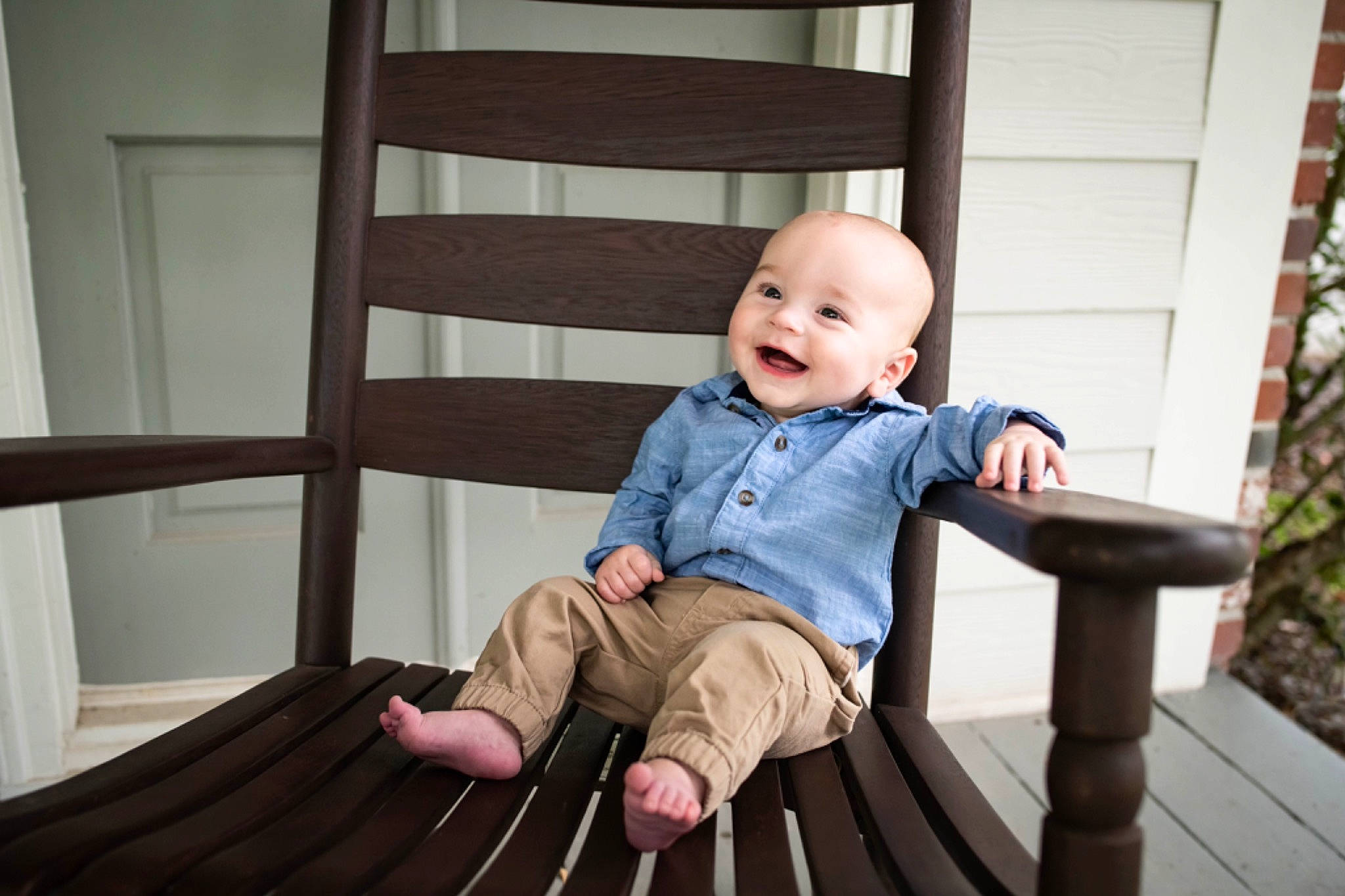Evan is registered to the contest to win money with this photo: baby, baby_toddler_clothing, child, comfort, deck, door, flash_photography, flooring, happy, hardwood, joy, leisure, person, portrait_photography, sitting, sleeve, smile, t_shirt, toddler, wood