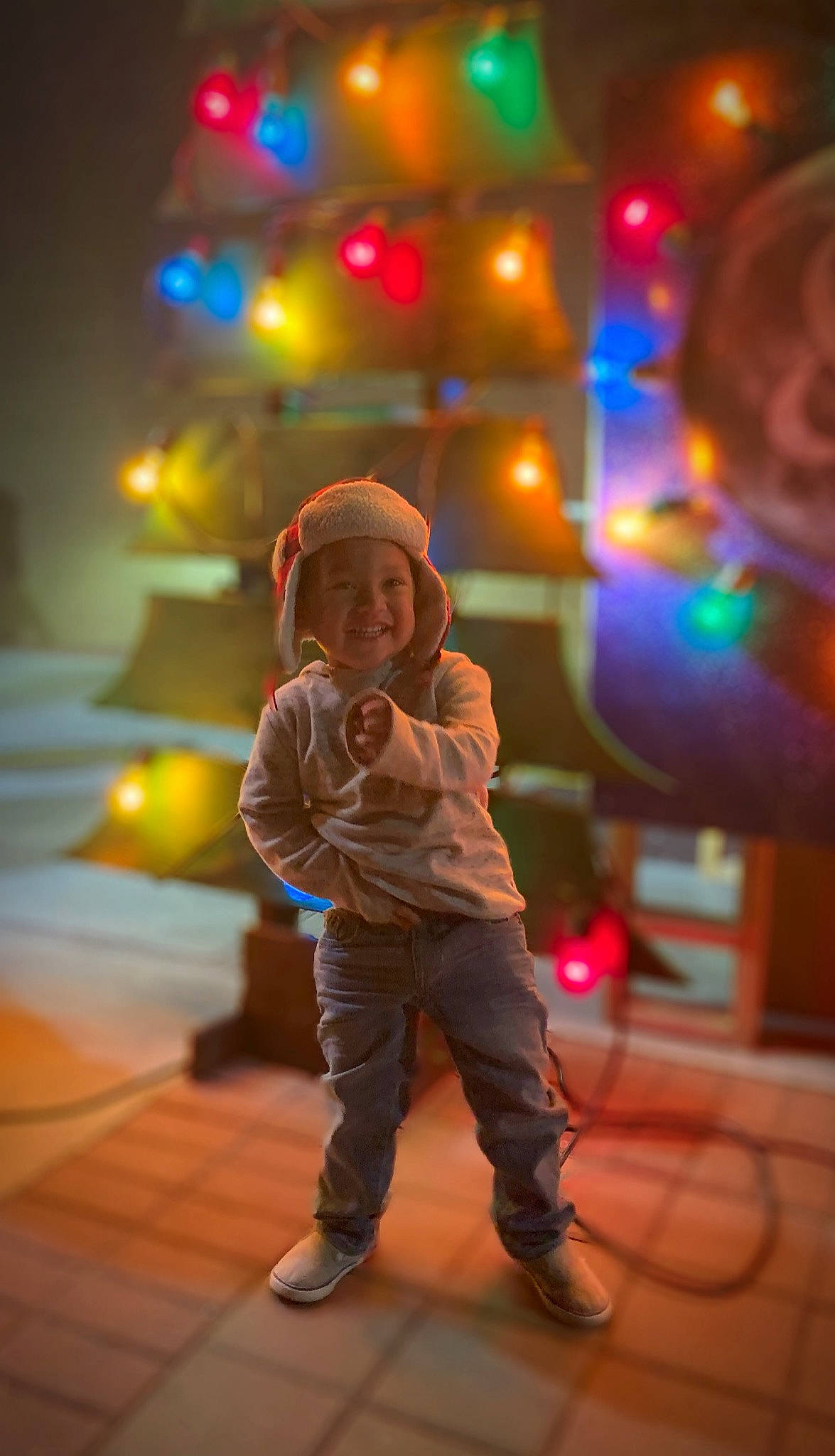 Liam Cross joined the competition — help win amazing prizes! child, christmas, fun, happy, joy, light, person, photography, play, smile, snapshot, standing, toddler, tree, vacation
