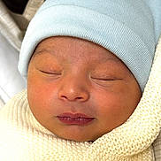 Marlex is registered to the contest to win money with this photo: newborn, baby, sleeping, face, hat, knit_blanket, closeup, infant, wrapped, cozy, soft_texture, peaceful, child, skin, portrait, headwear, resting, cute, fresh, tiny