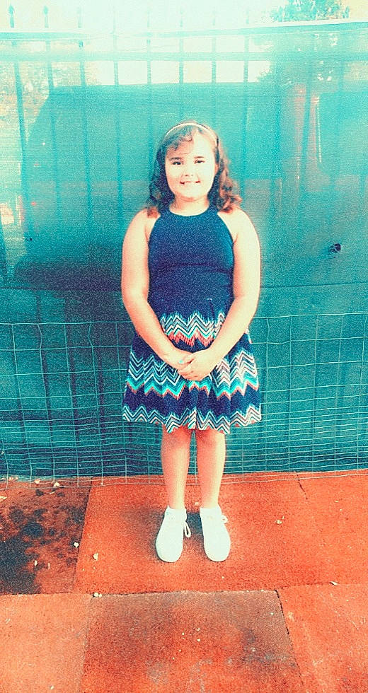 Mea is registered to the contest to win money with this photo: aqua, azure, day_dress, dress, electric_blue, eye, face, flash_photography, hairstyle, happy, human_leg, joy, knee, one_piece_garment, pattern, person, smile, standing, textile, thigh