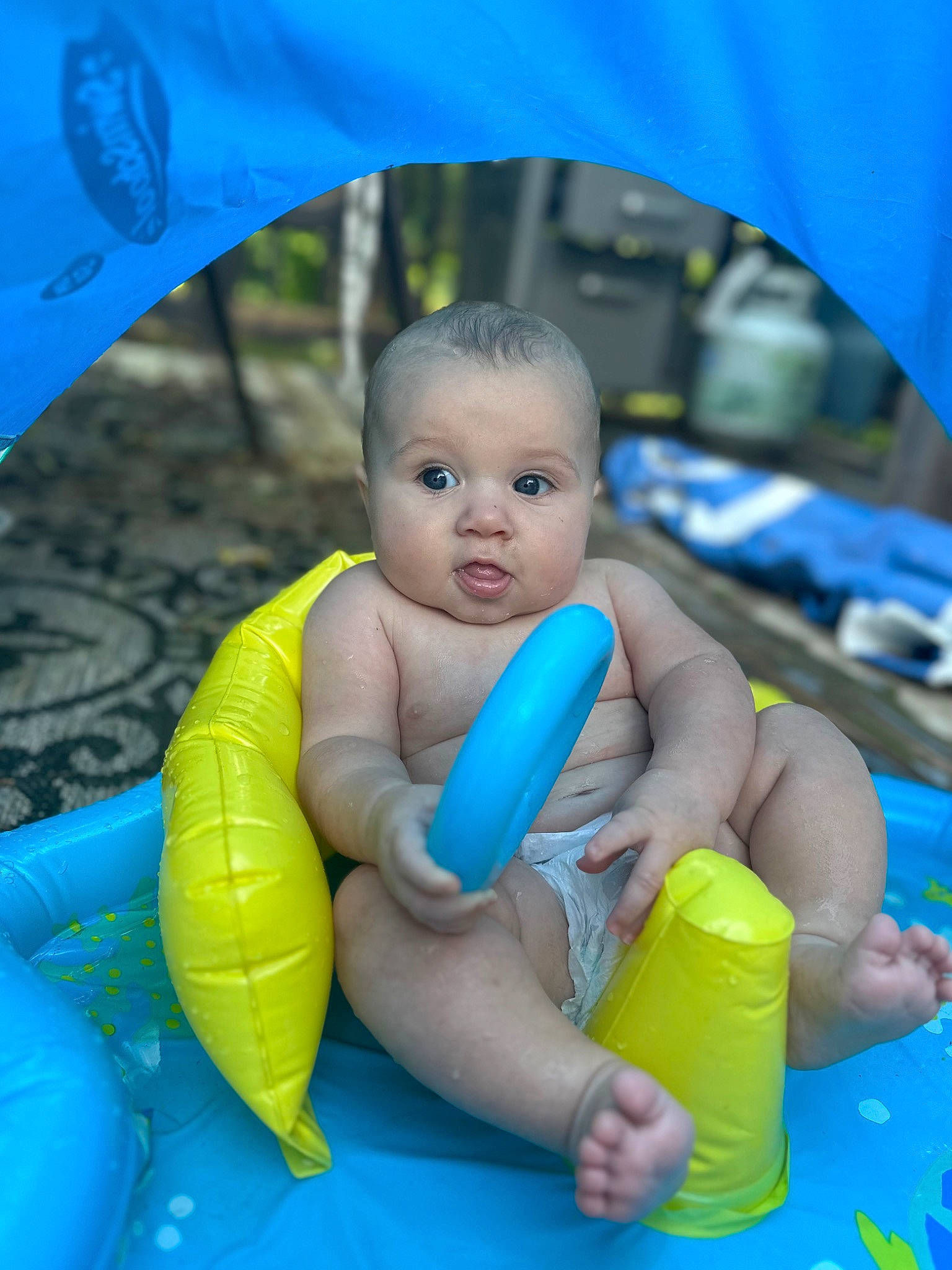 Clyde is registered to the contest to win money with this photo: azure, baby, barefoot, child, electric_blue, finger, foot, fun, happy, human_leg, leisure, nail, person, play, recreation, skin, snapshot, summer, surprise, thumb