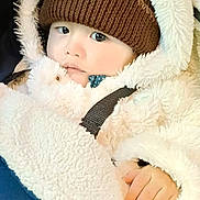 Jared- Matthew Ramos participe au concours pour gagner de l'argent avec cette photo : baby, blanket, bundle_up, candid, child, close_up, cold_weather, cute, face, fur, hand, hat, hood, infant, jacket, knit_hat, outdoor_gear, portrait, warm_clothing, winter_wear