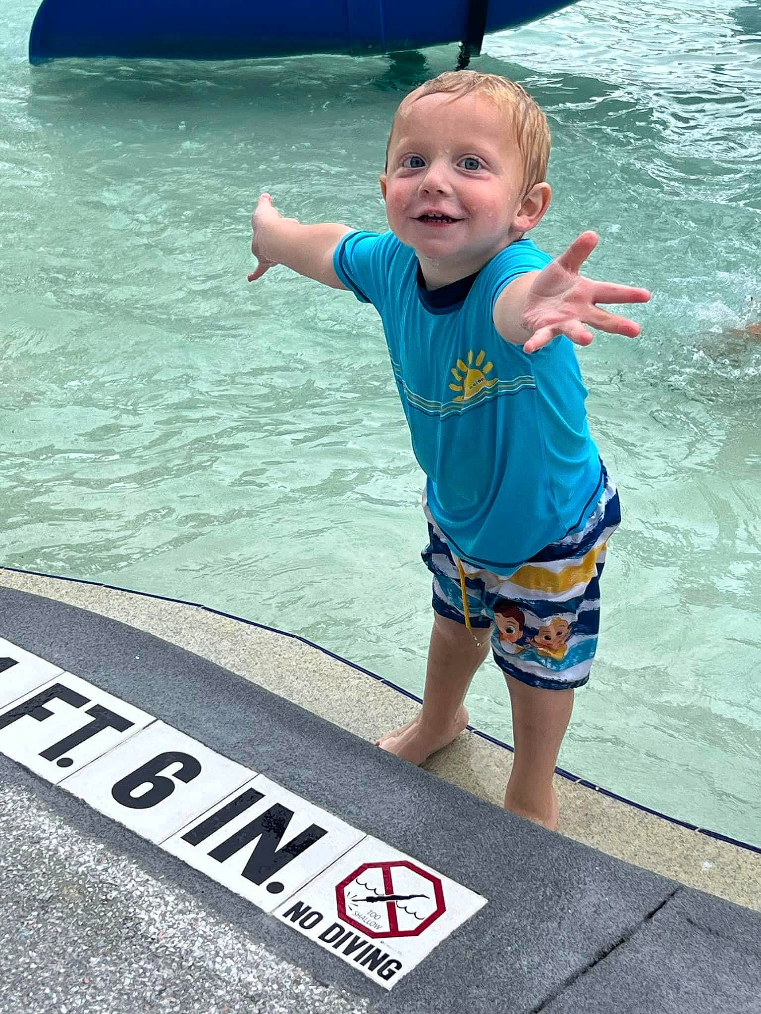 Easton is registered to the contest to win money with this photo: asphalt, baby_toddler_clothing, barefoot, child, electric_blue, fun, happy, joy, lake, leisure, ocean, person, photograph, recreation, rectangle, sleeve, smile, summer, t_shirt, toddler