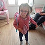 Athenais a rejoint le concours — aidez-le/la à gagner de superbes lots ! adult, backpack, bedroom, casual_clothing, child, curious, furniture, girl, glasses, indoor, jeans, mirror, phone, pink, pink_cardigan, socks, standing, toy, window, wood_floor