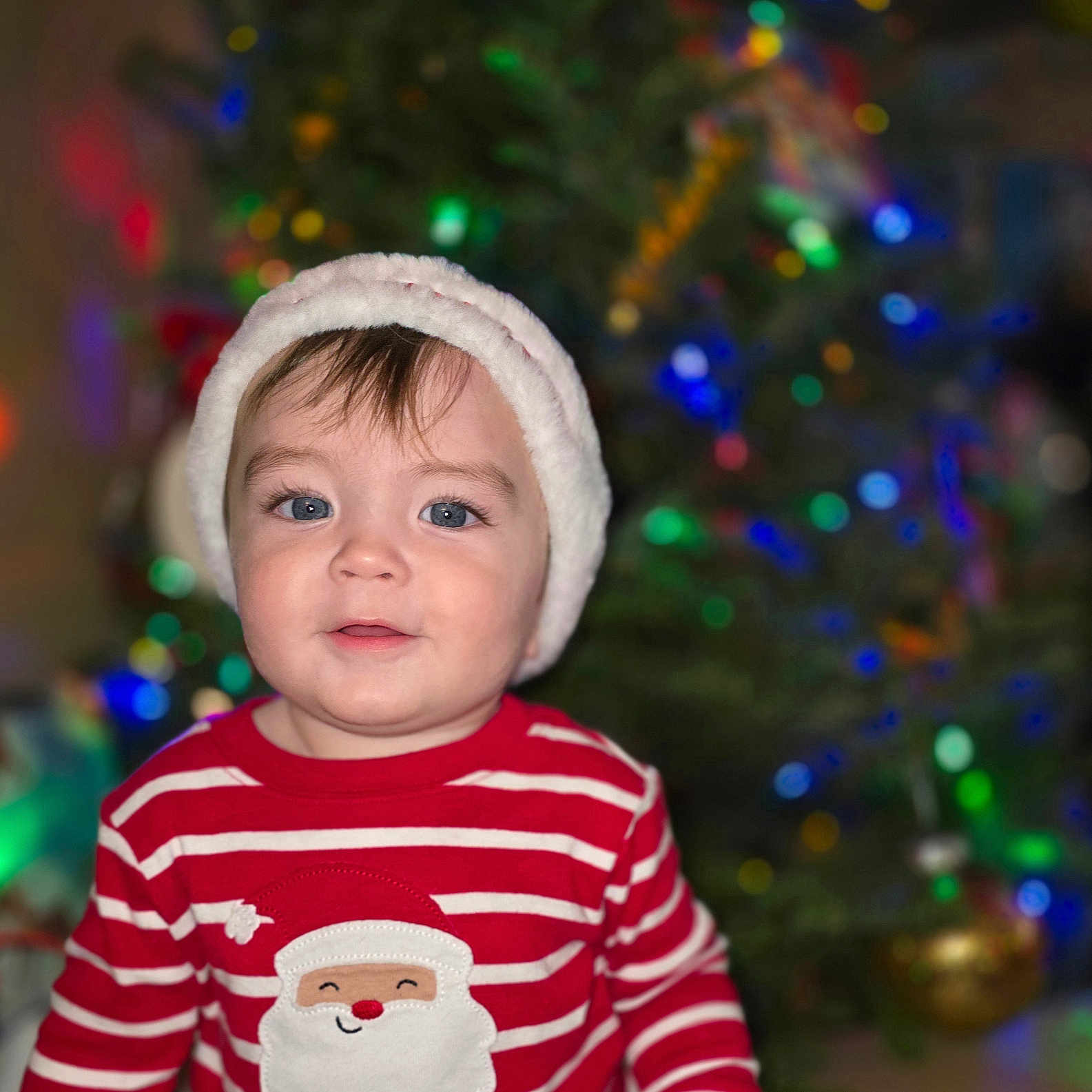 Jarrod is registered to the contest to win money with this photo: accessories, baby, beanie, bodypart, bonnet, cap, clothing, face, finger, hand, happy, hat, head, knitwear, lighting, person, photography, portrait, smile, sweater